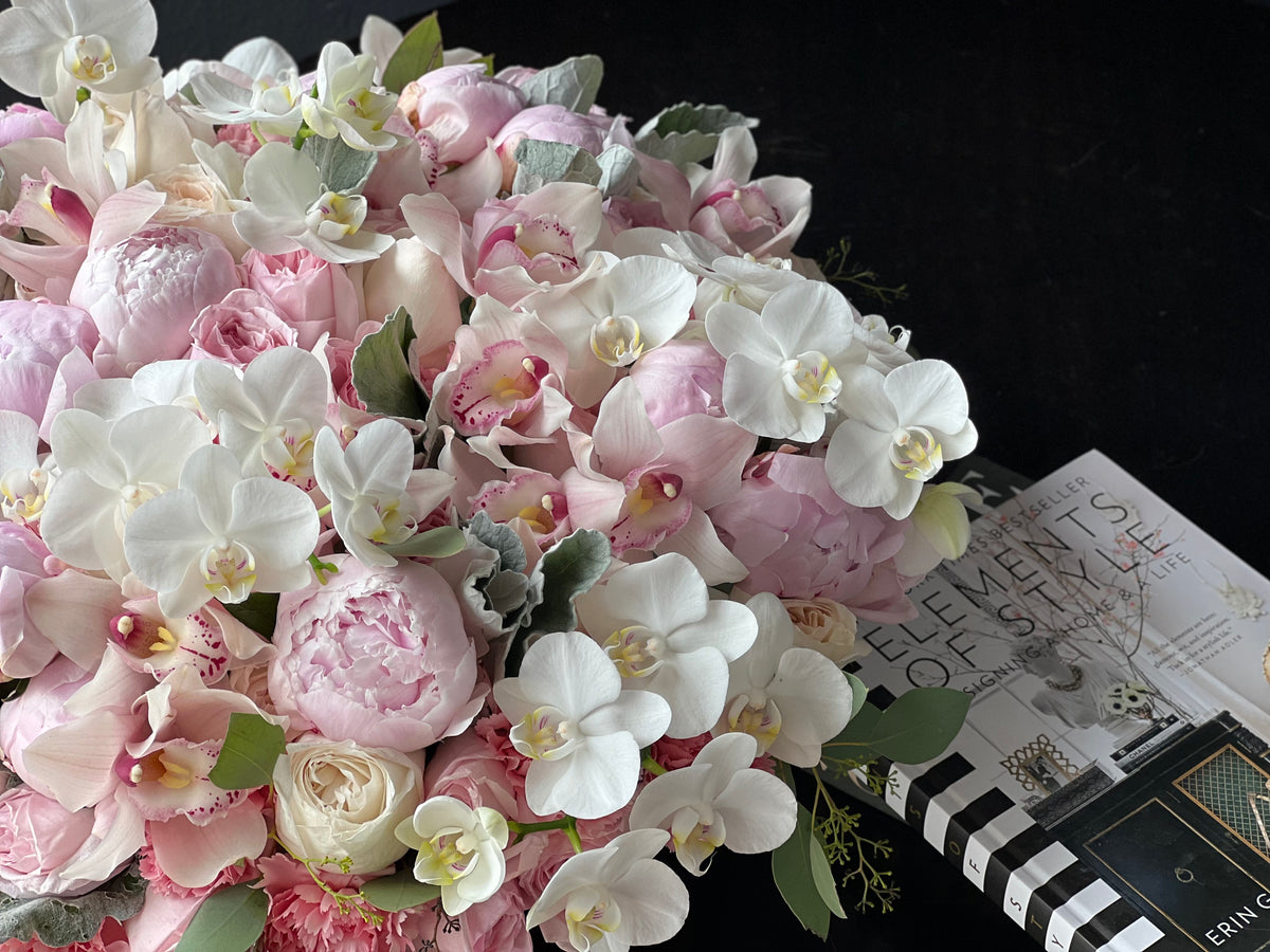 Pink peonies roses and orchids luxury centerpiece