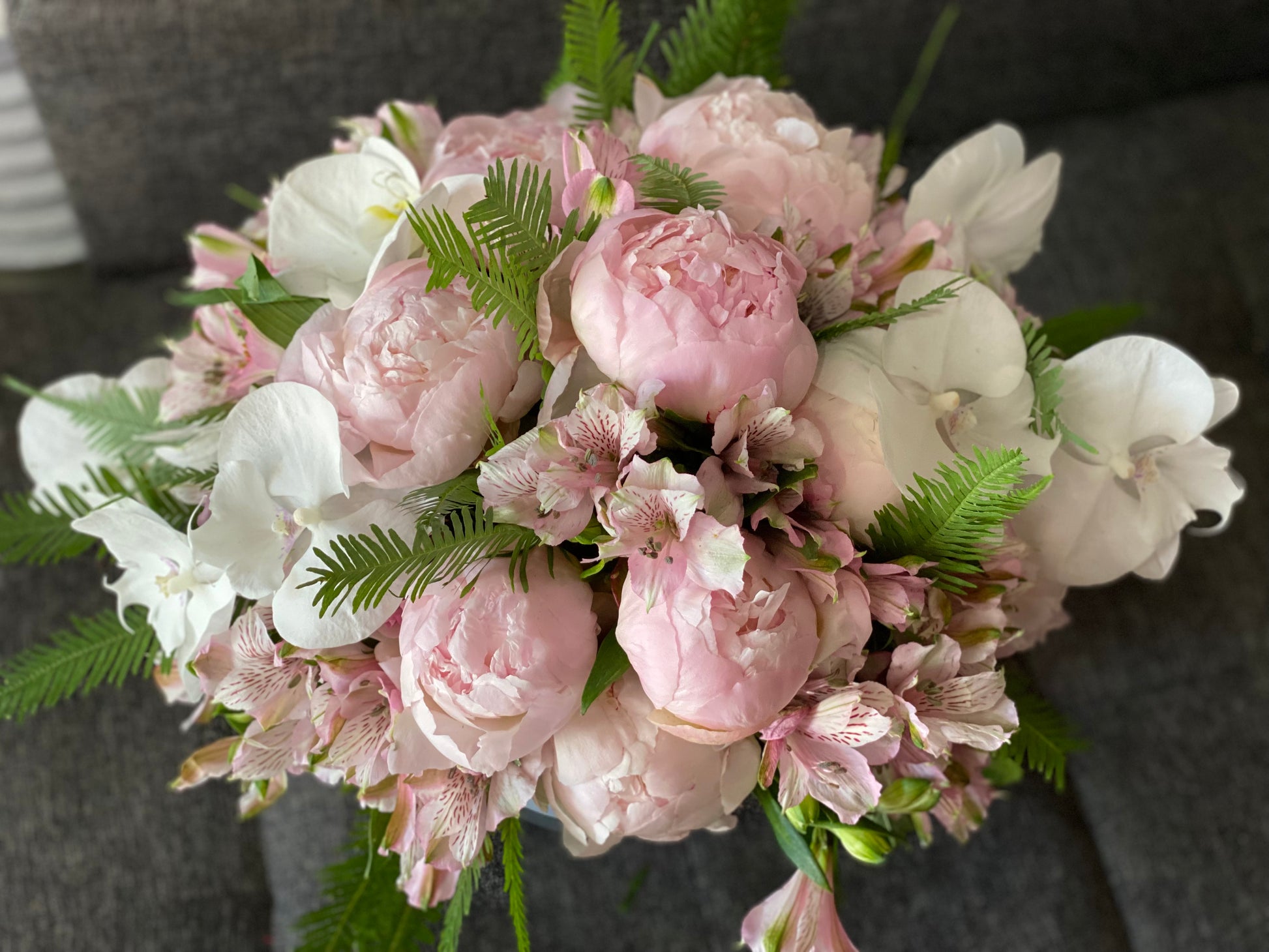 Pink peony and orchid flower arrangement in Miami Beach