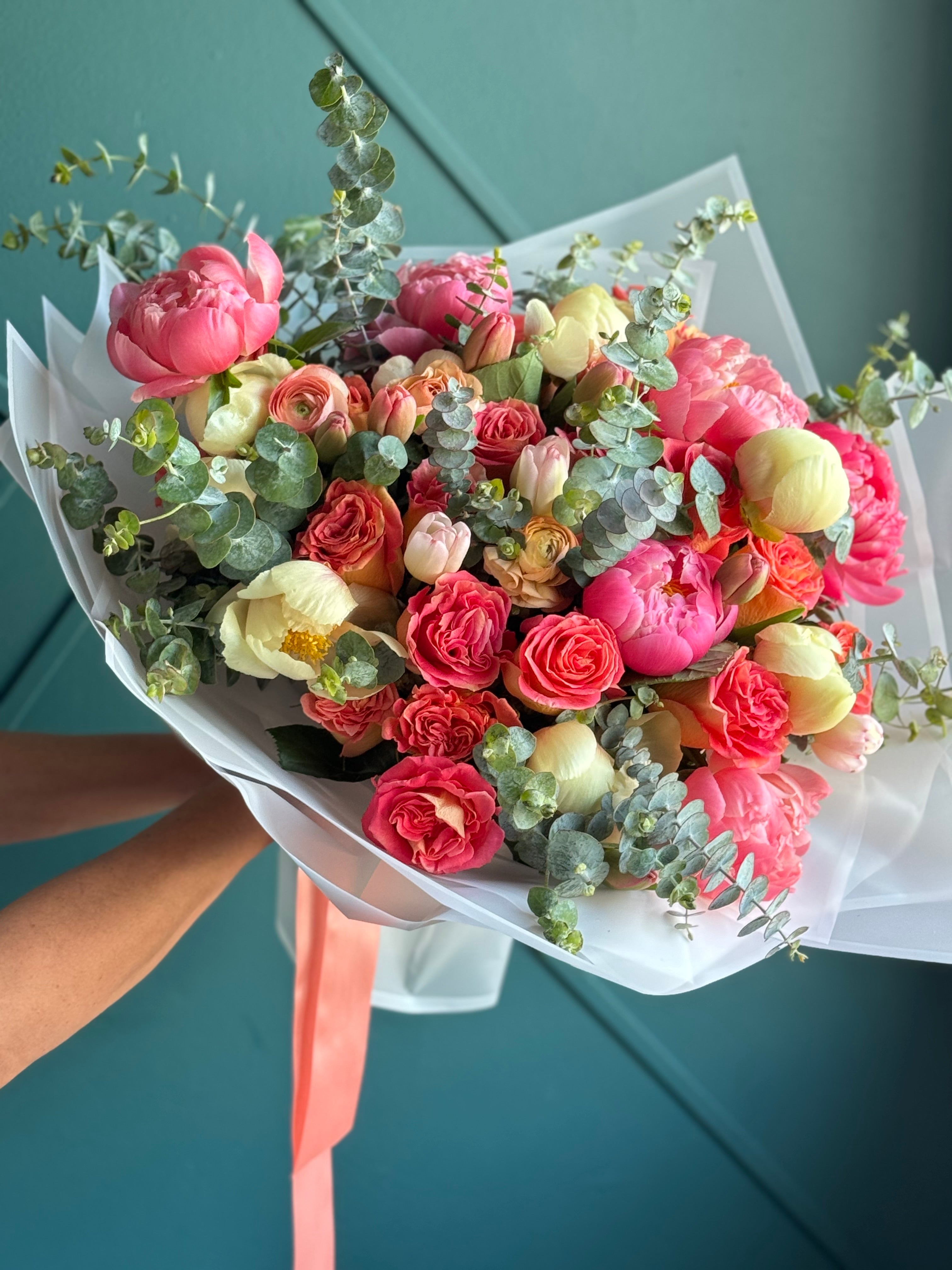 Pink peony bouquet with yellow tulips and eucalyptus