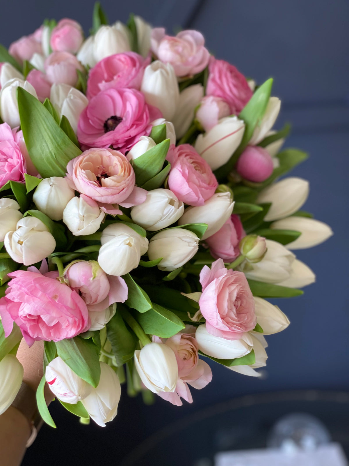 Pink ranunculus white tulips and peonies flower arrangement Miami