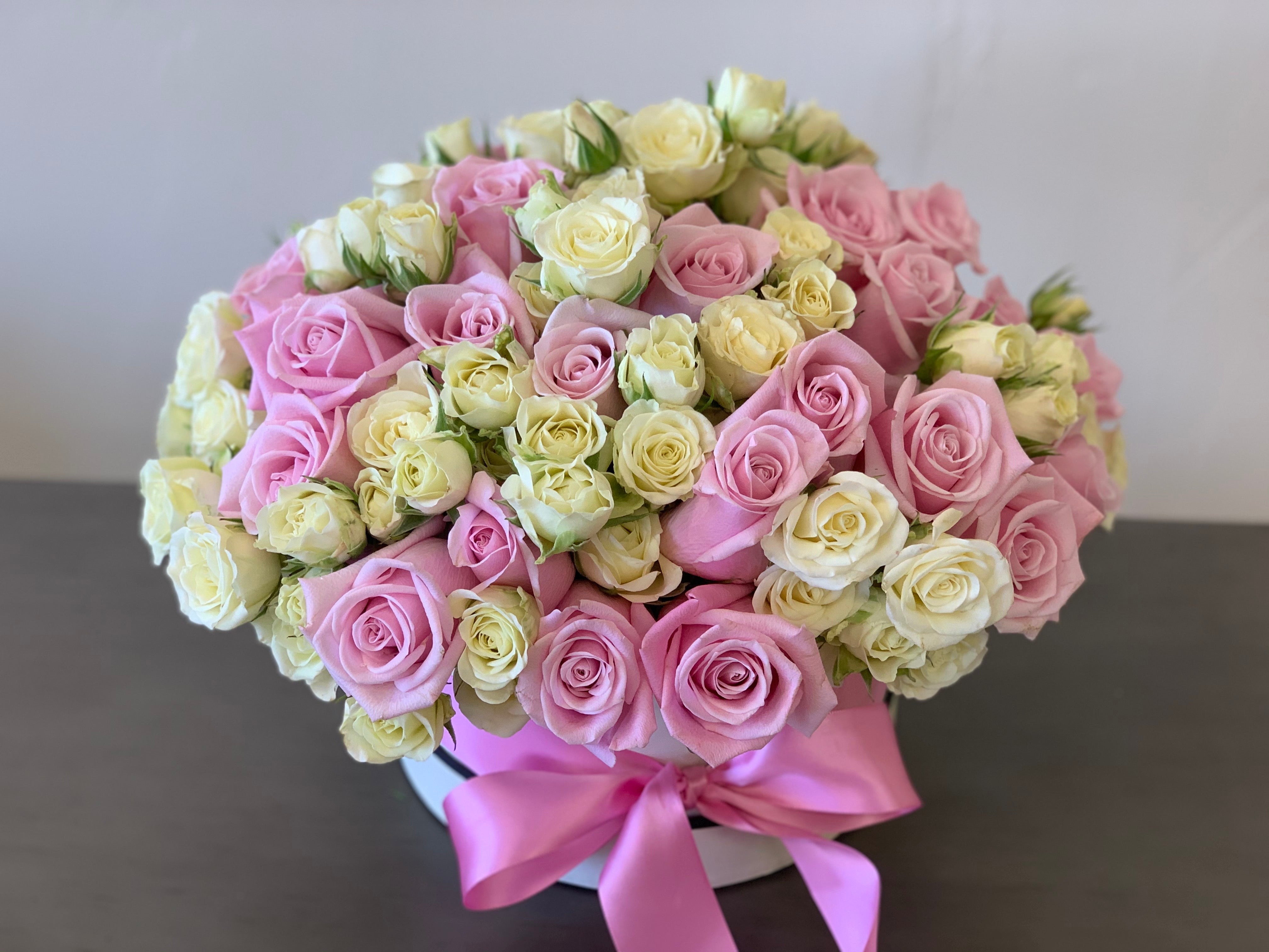 Pink roses and white spray roses in a luxury flower box Miami