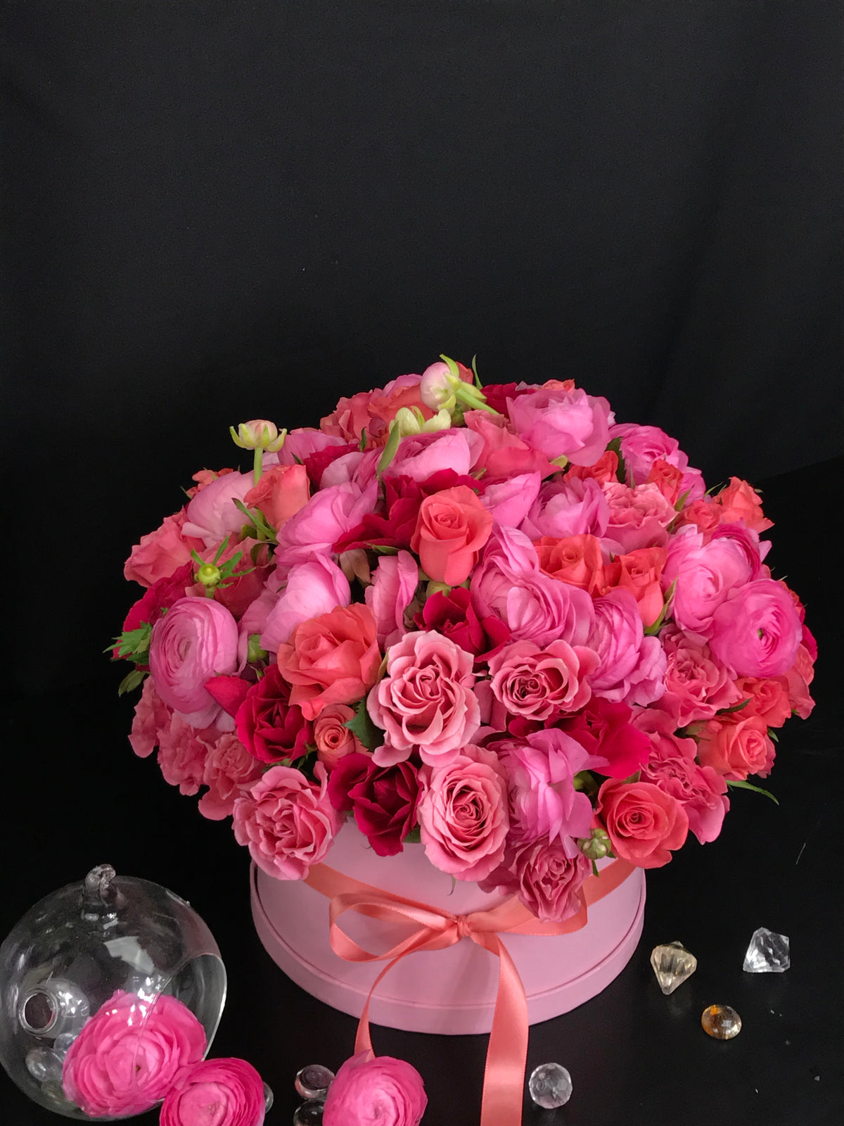 Pink roses spray roses and ranunculus arrangement