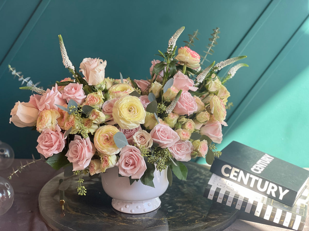 Pink roses spray roses and ranunculus floral arrangement