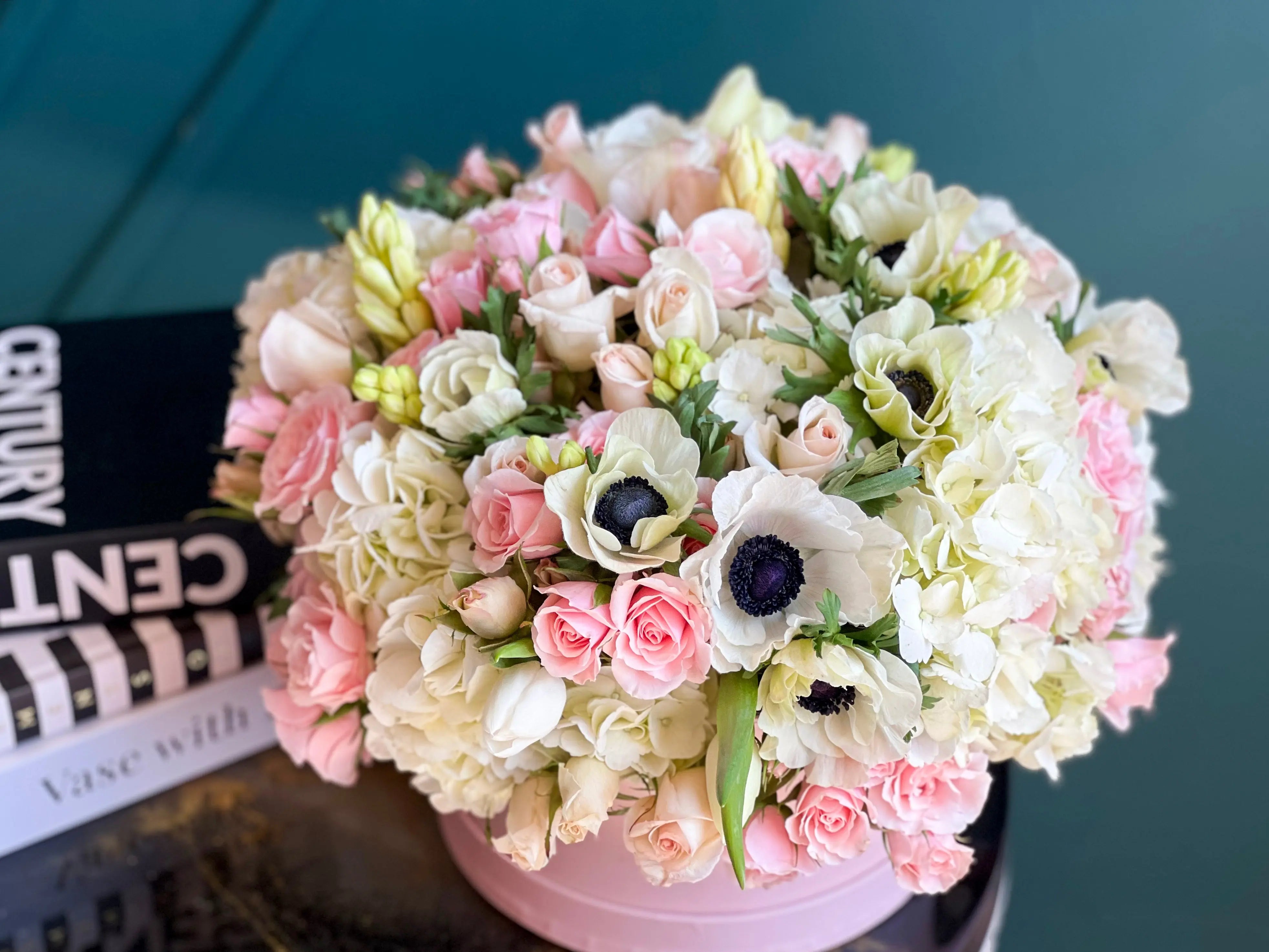 Pink roses spray roses and white hydrangeas flower arrangement