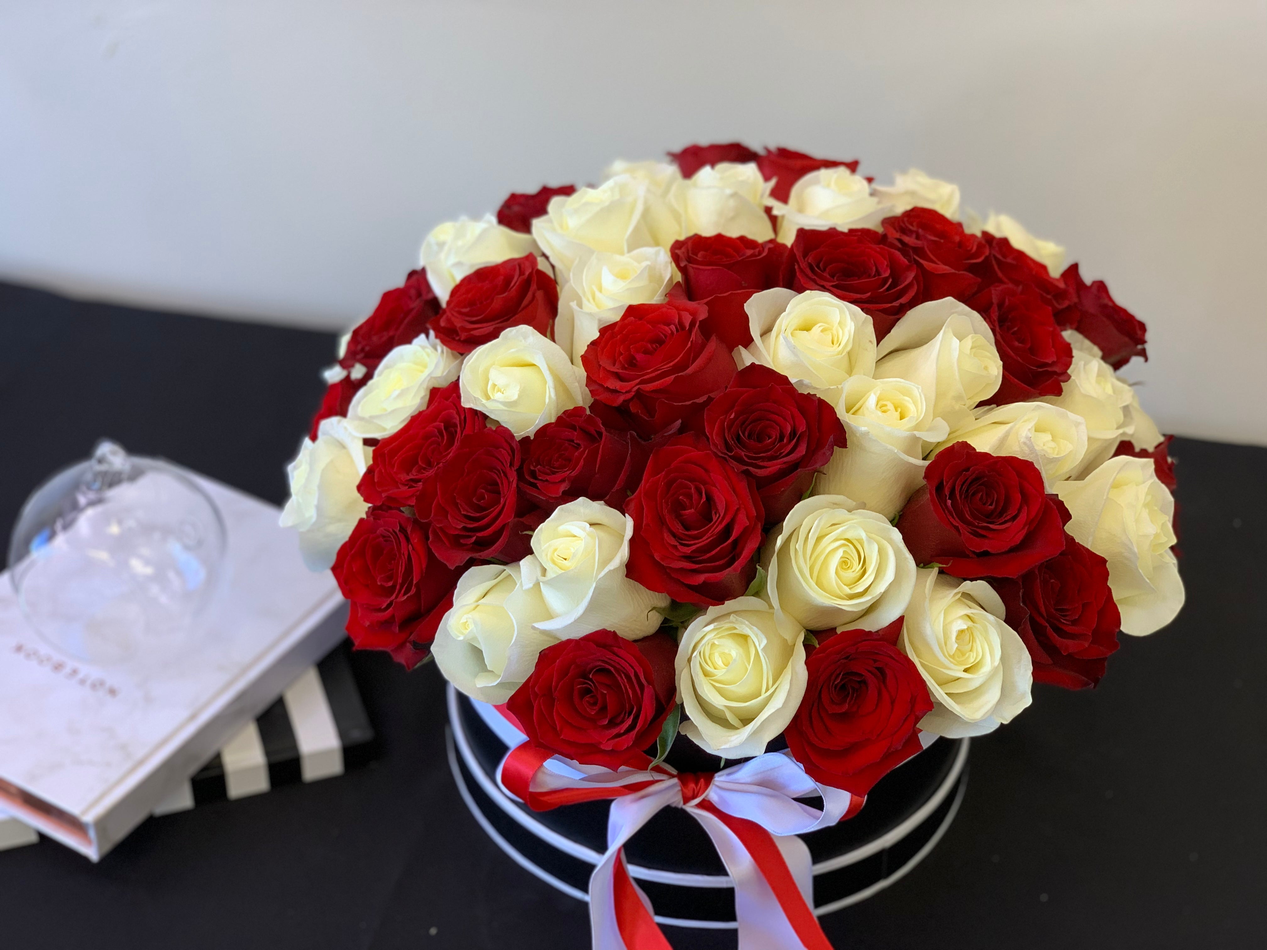 Premium 100 rose arrangement with classic red and white roses