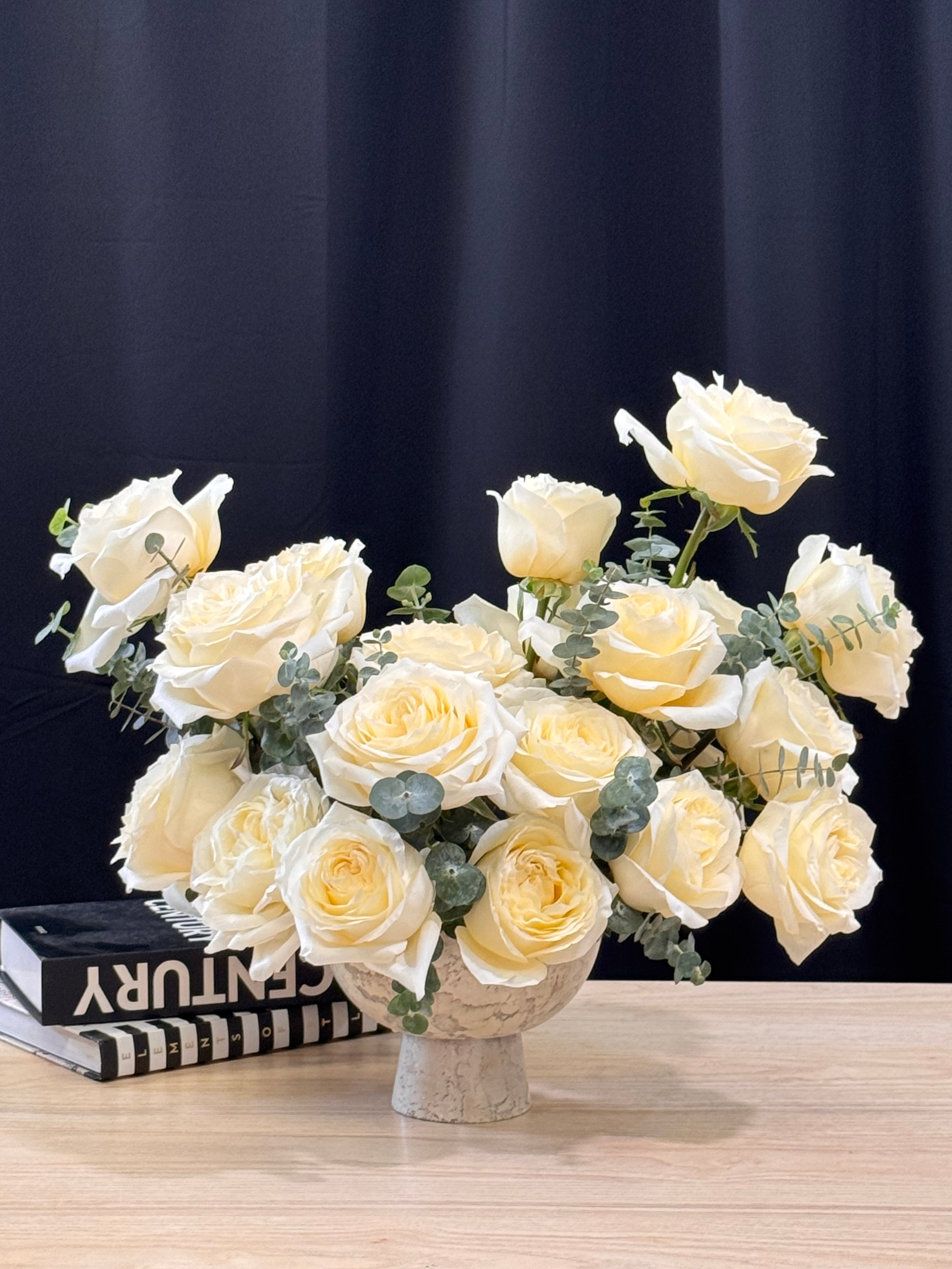 Premium garden roses in soft white and ivory tones