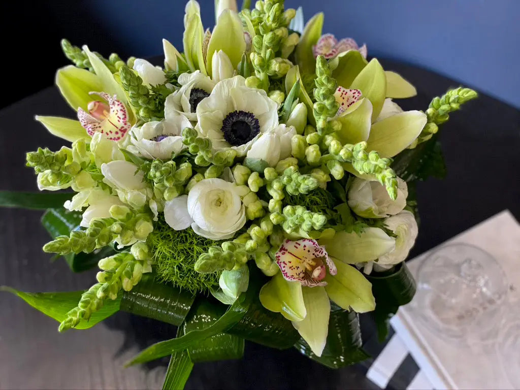 Premium ivory floral arrangement with fresh seasonal greenery