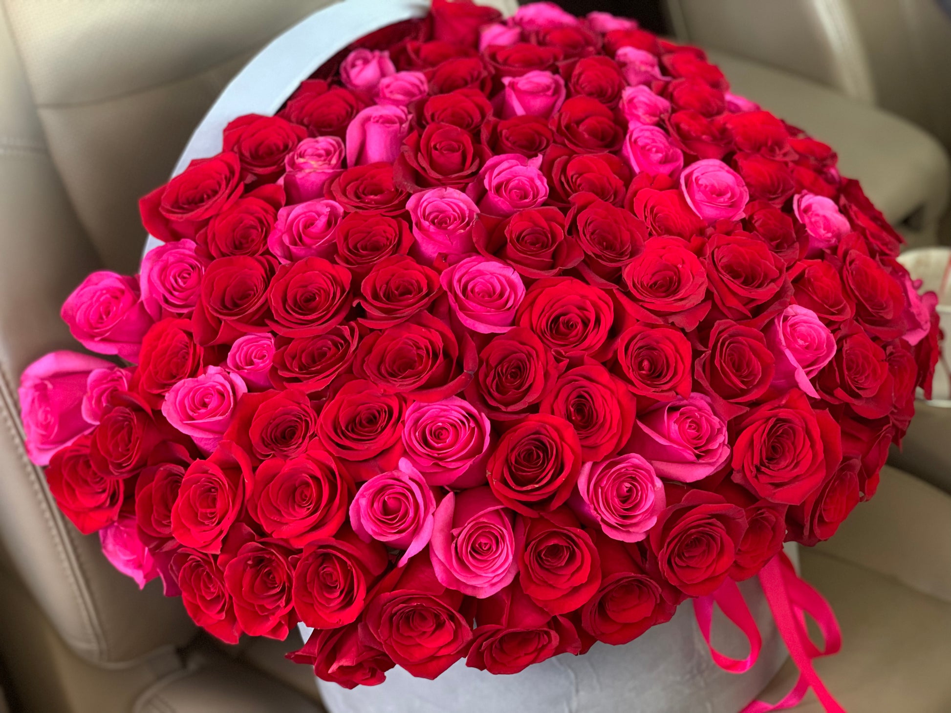 Premium red and hot pink roses arranged in luxury flower box