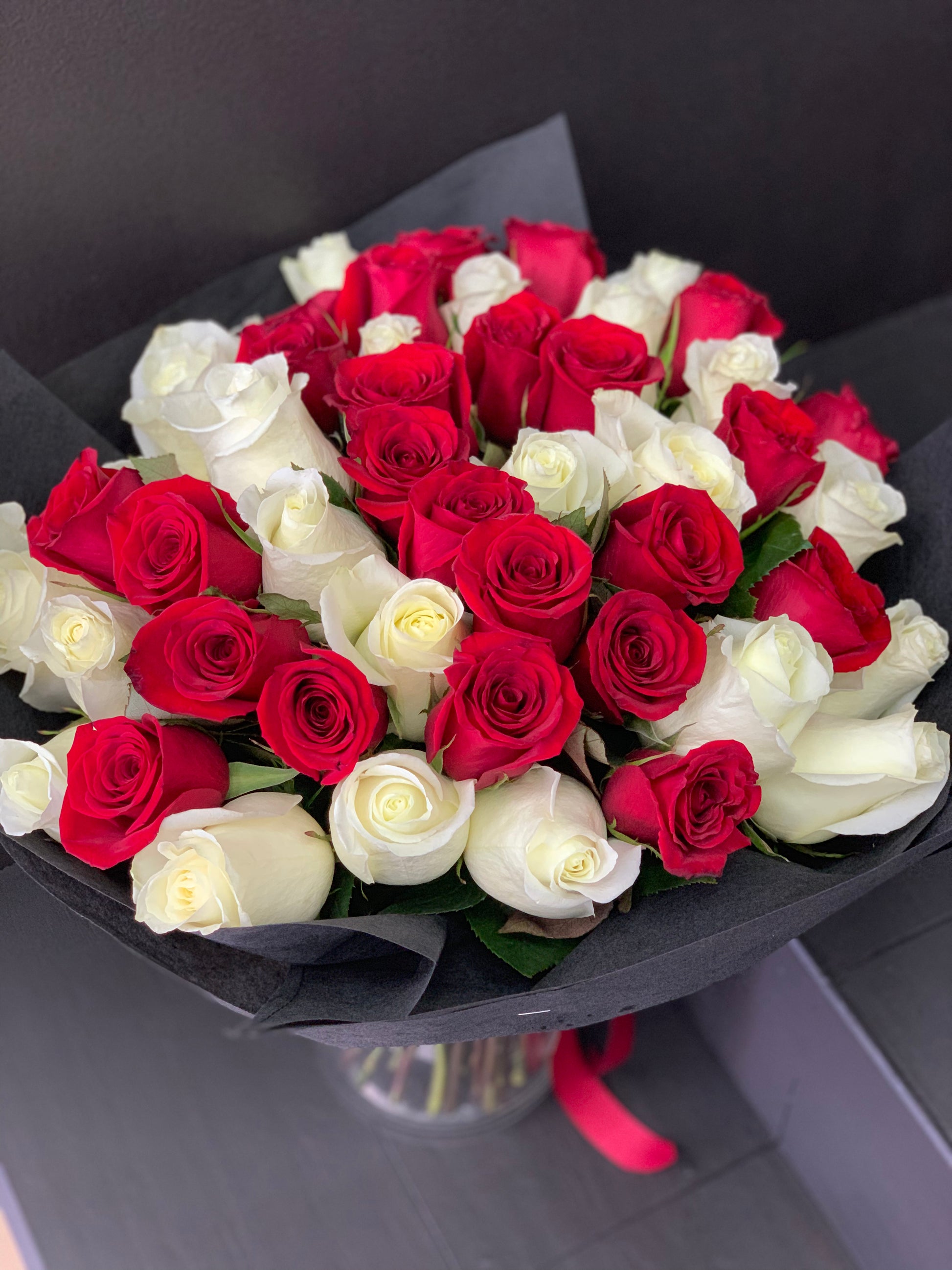 Premium red and white rose bouquet for anniversary in Miami