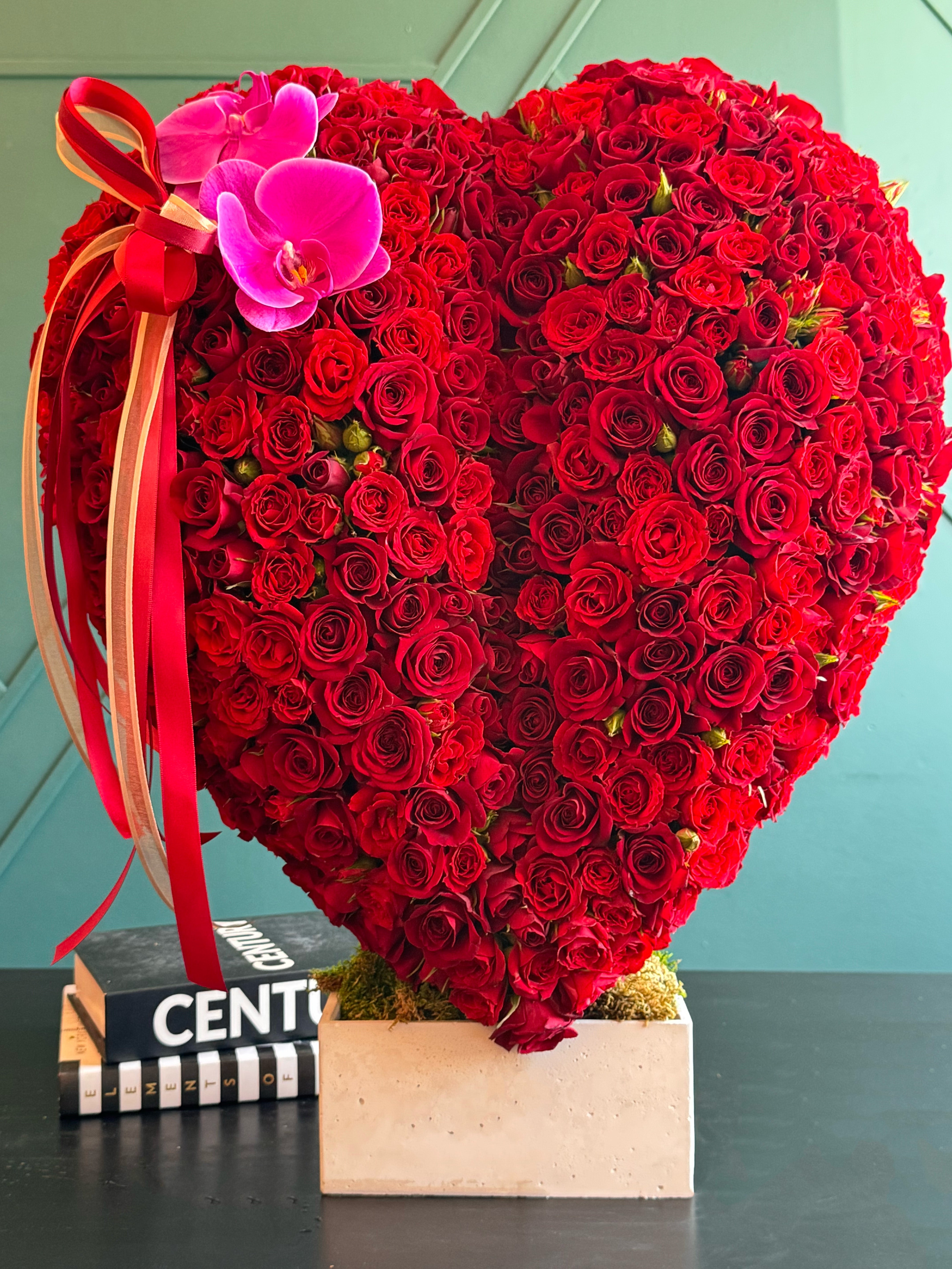 Premium red rose heart with decorative ribbons