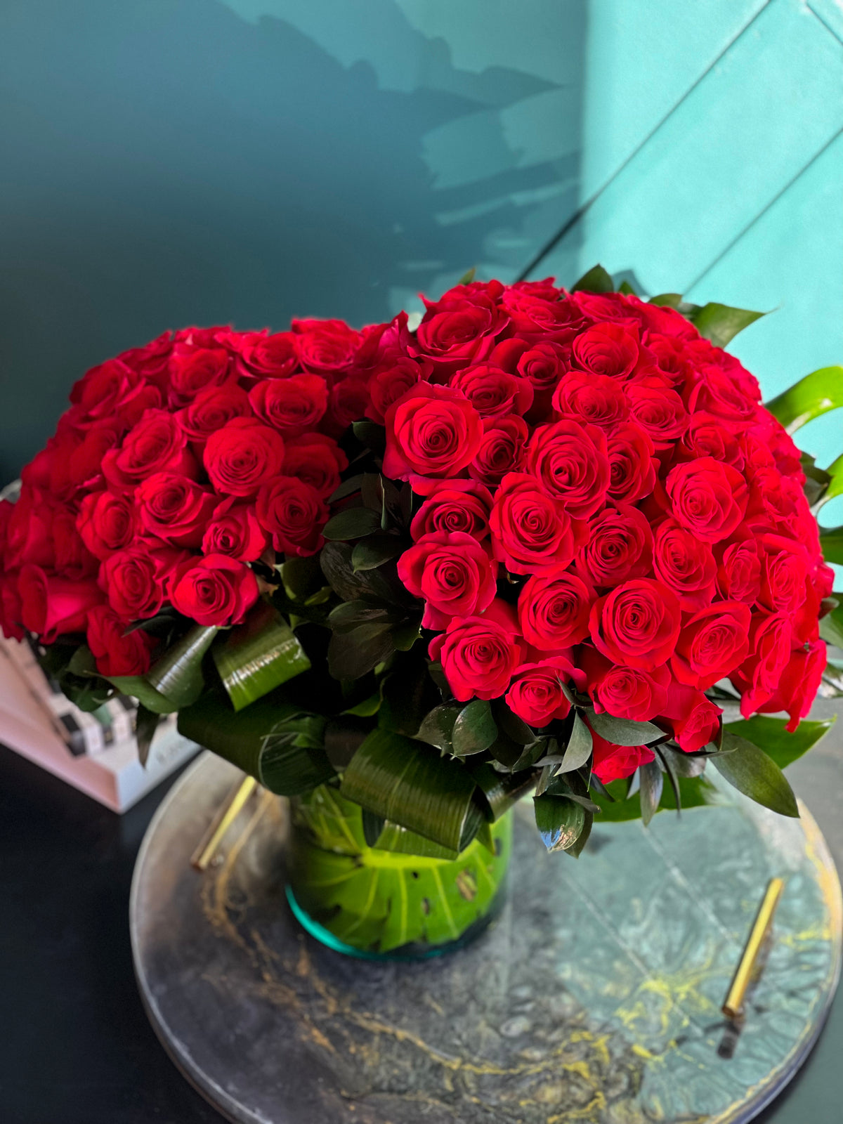 Premium red roses in glass vase for romantic gift
