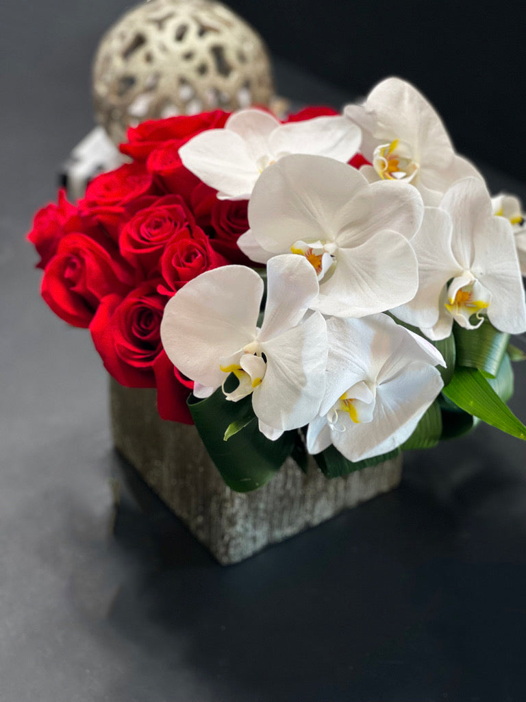 Premium red roses with cascading white orchids
