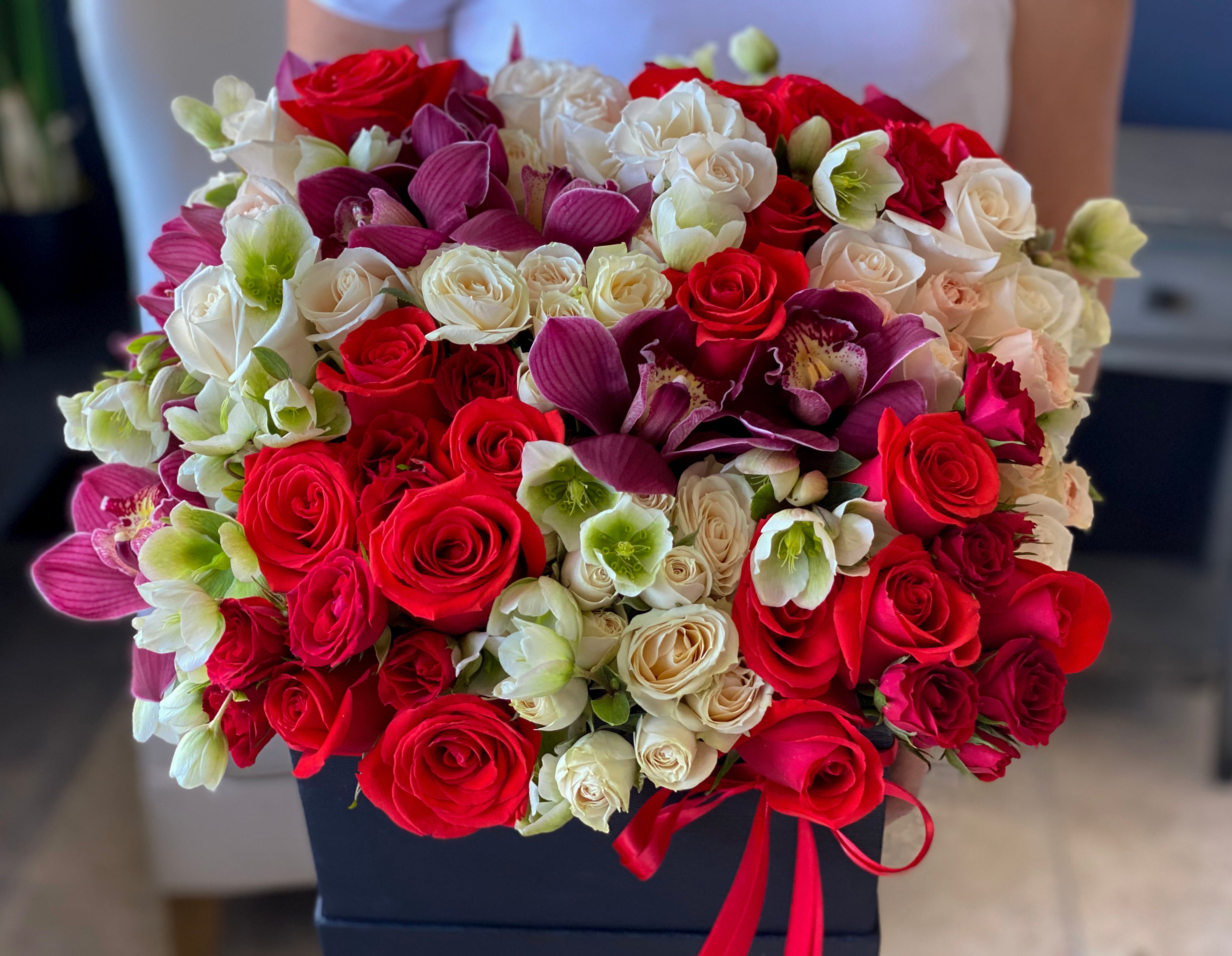 Premium red spray roses and cymbidium orchids arrangement Miami