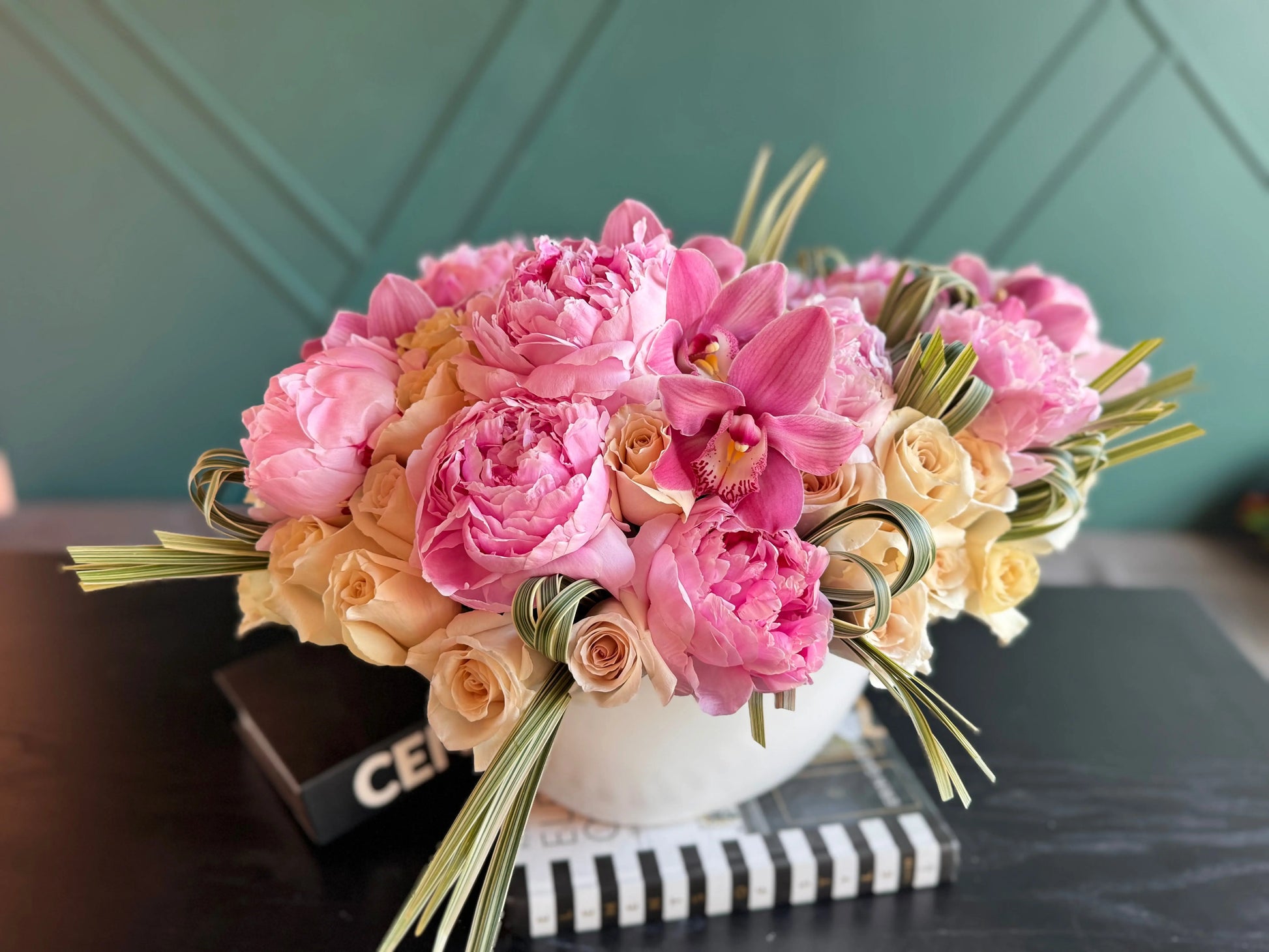 Premium vase arrangement with peonies roses and orchids for flower delivery in Miami