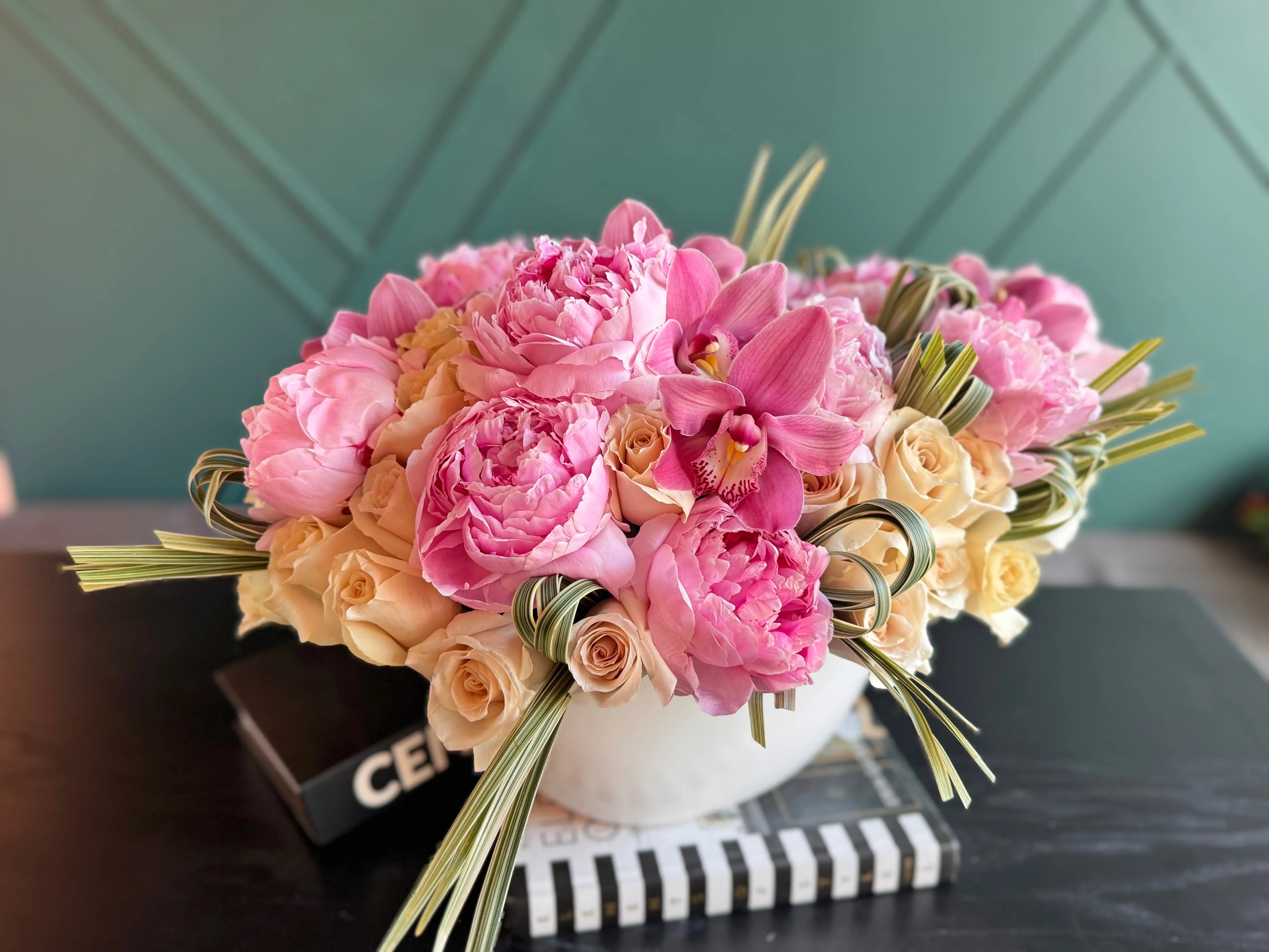 Premium vase arrangement with peonies roses and orchids for flower delivery in Miami