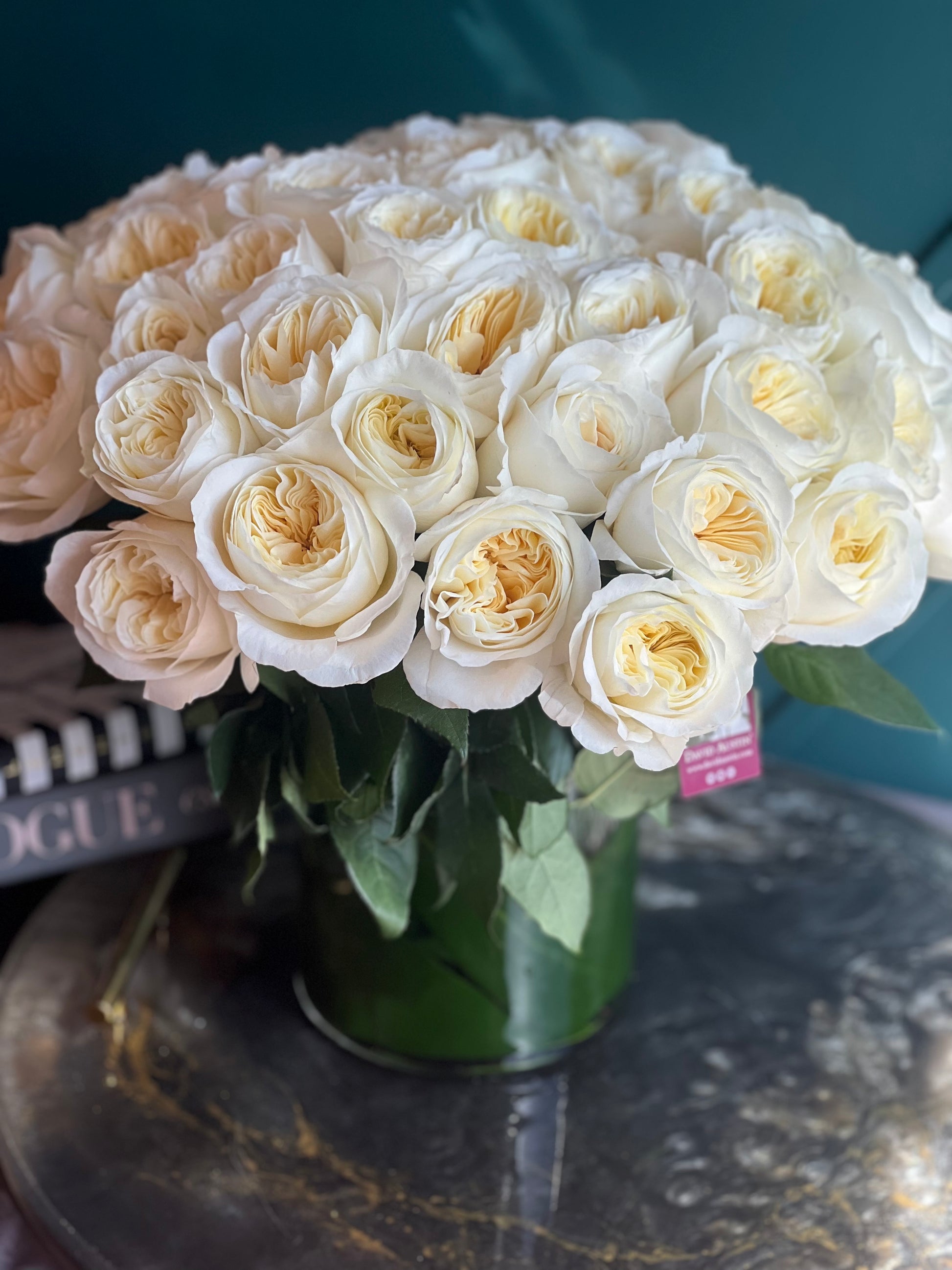 Premium white and cream garden roses in a luxury floral design
