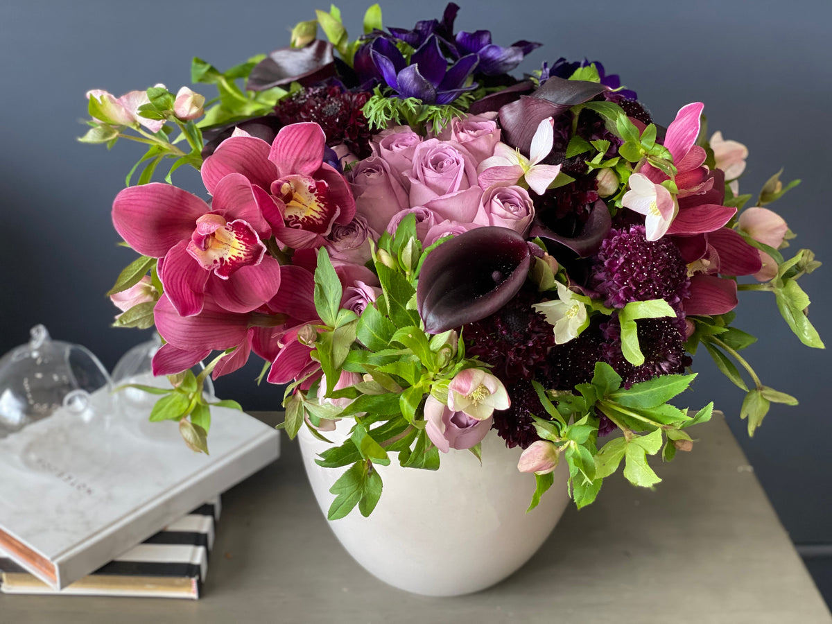 Purple Cymbidium orchids roses and seasonal flowers