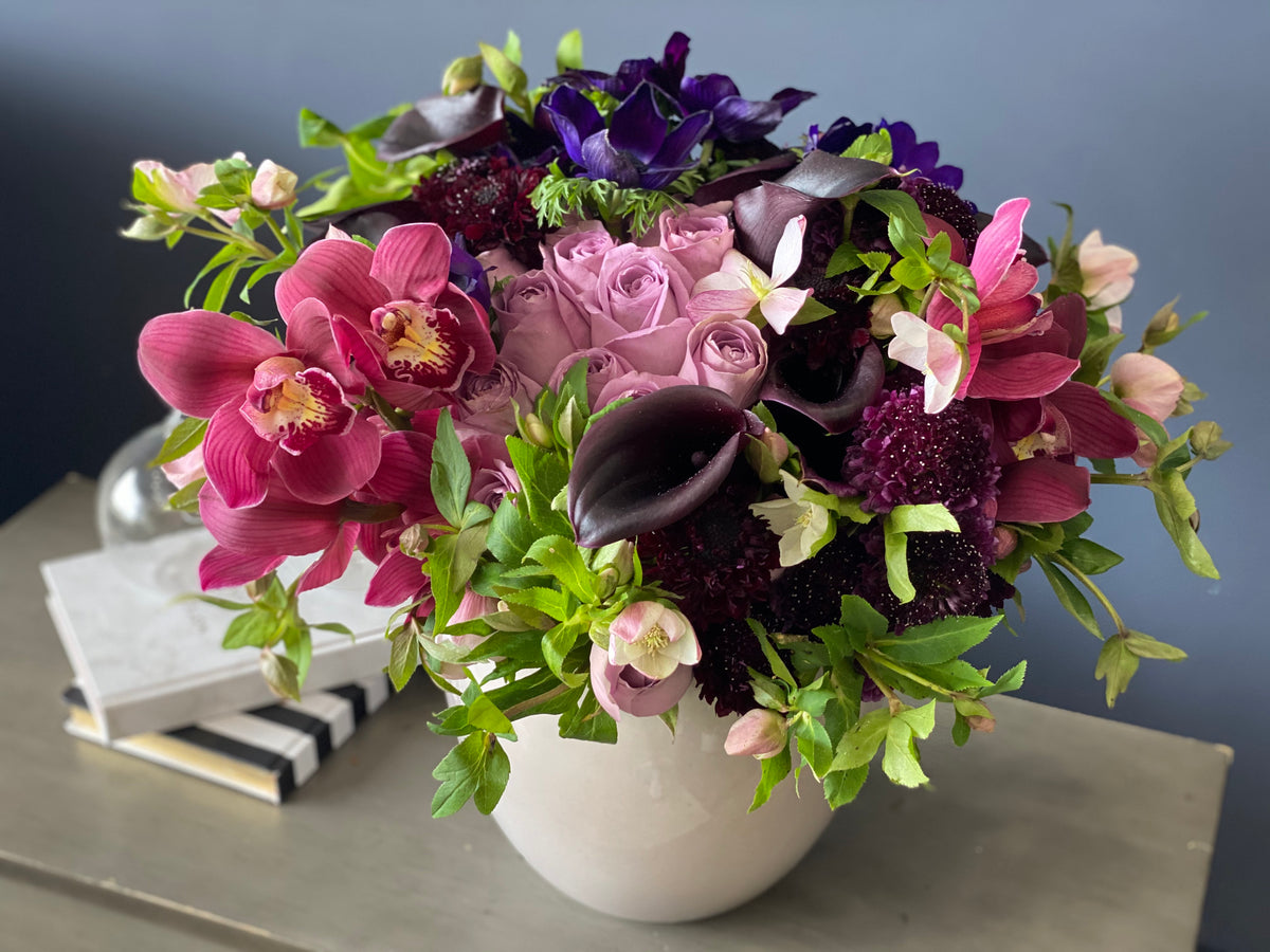 Purple orchid and rose centerpiece Miami