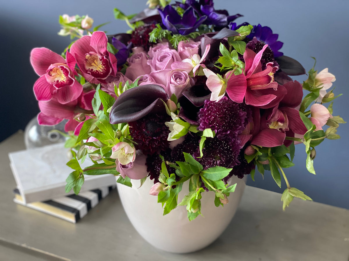 Purple roses and Cymbidium orchids luxury arrangement