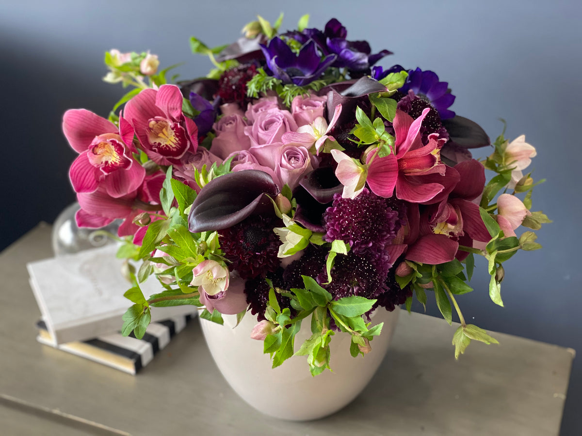 Purple roses calla lilies and Cymbidium orchids