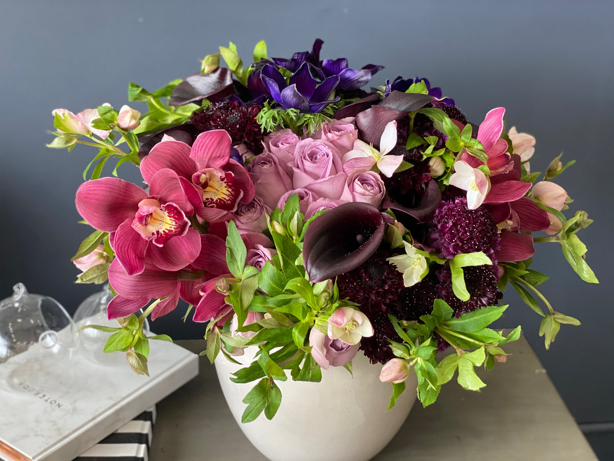 Purple roses orchids arrangement in Miami