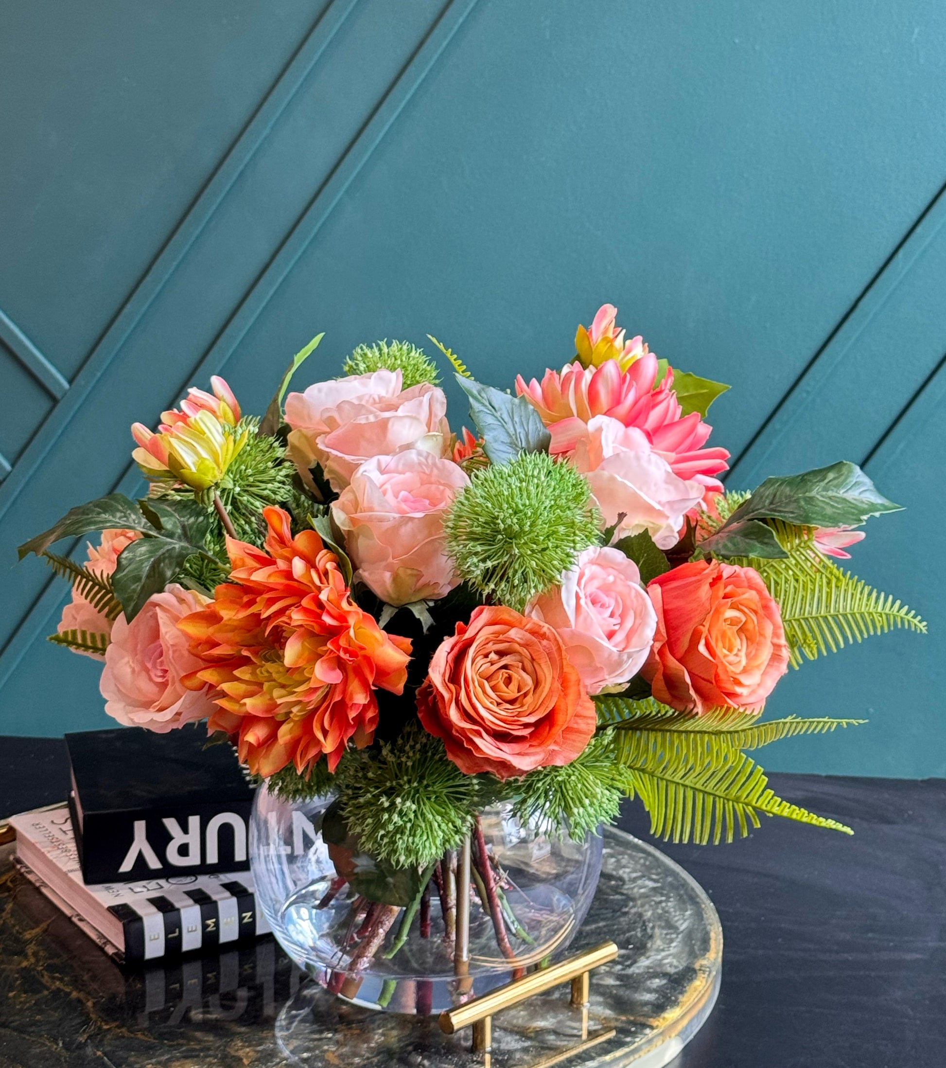 Real Touch flower arrangement with coral blooms, pink peonies, and decorative greenery.