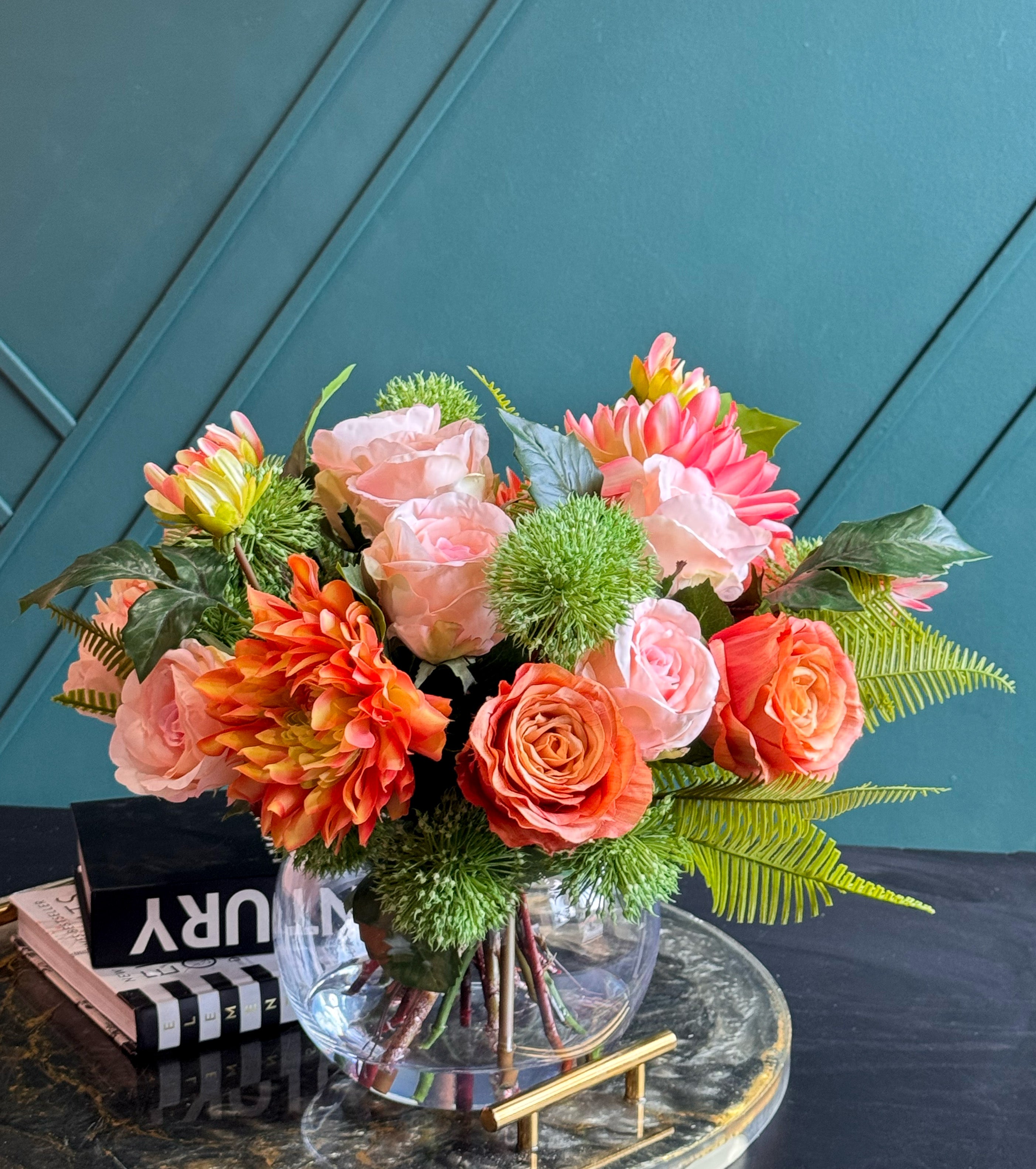 Real Touch flower arrangement with coral blooms, pink peonies, and decorative greenery.