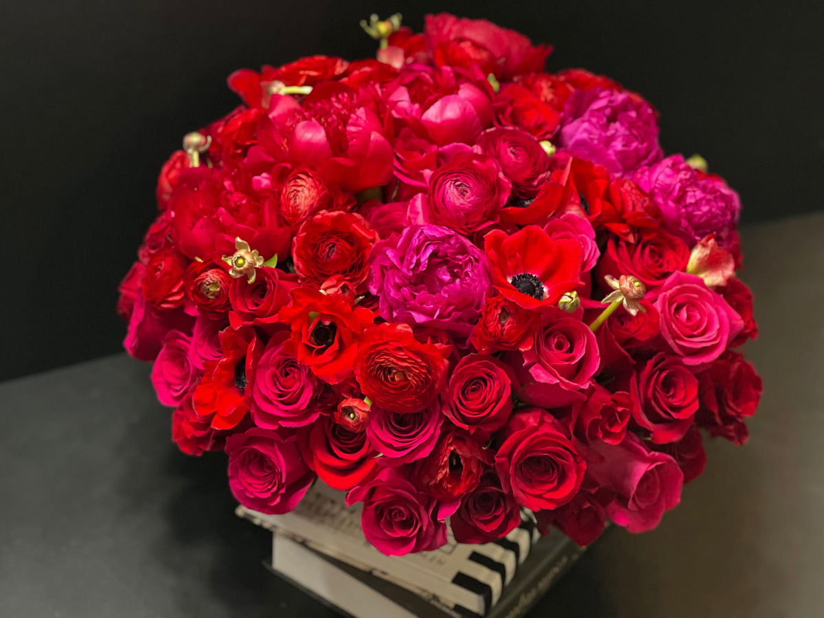 Red and hot pink roses and peonies luxury bouquet Miami