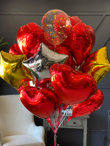 Red and metallic balloon bouquet with clear decorative balloons