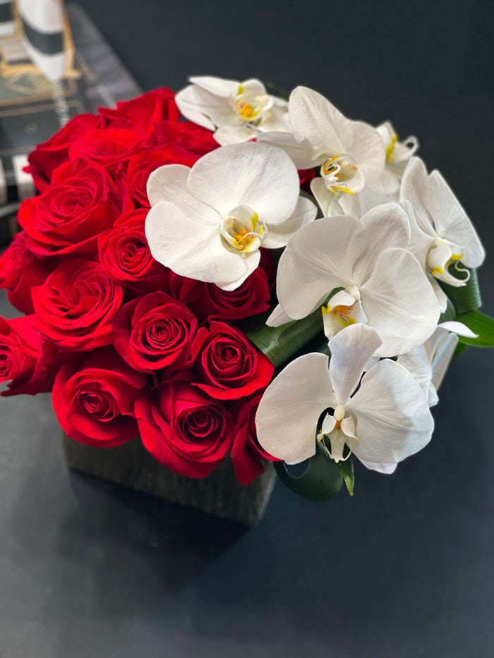Red roses and Phalaenopsis orchids arrangement Miami
