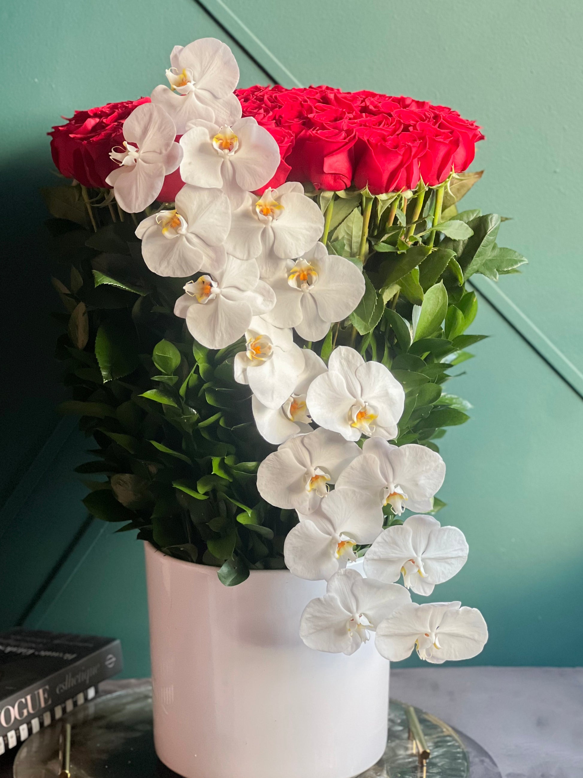 Red roses and white Phalaenopsis orchids for Miami flower delivery