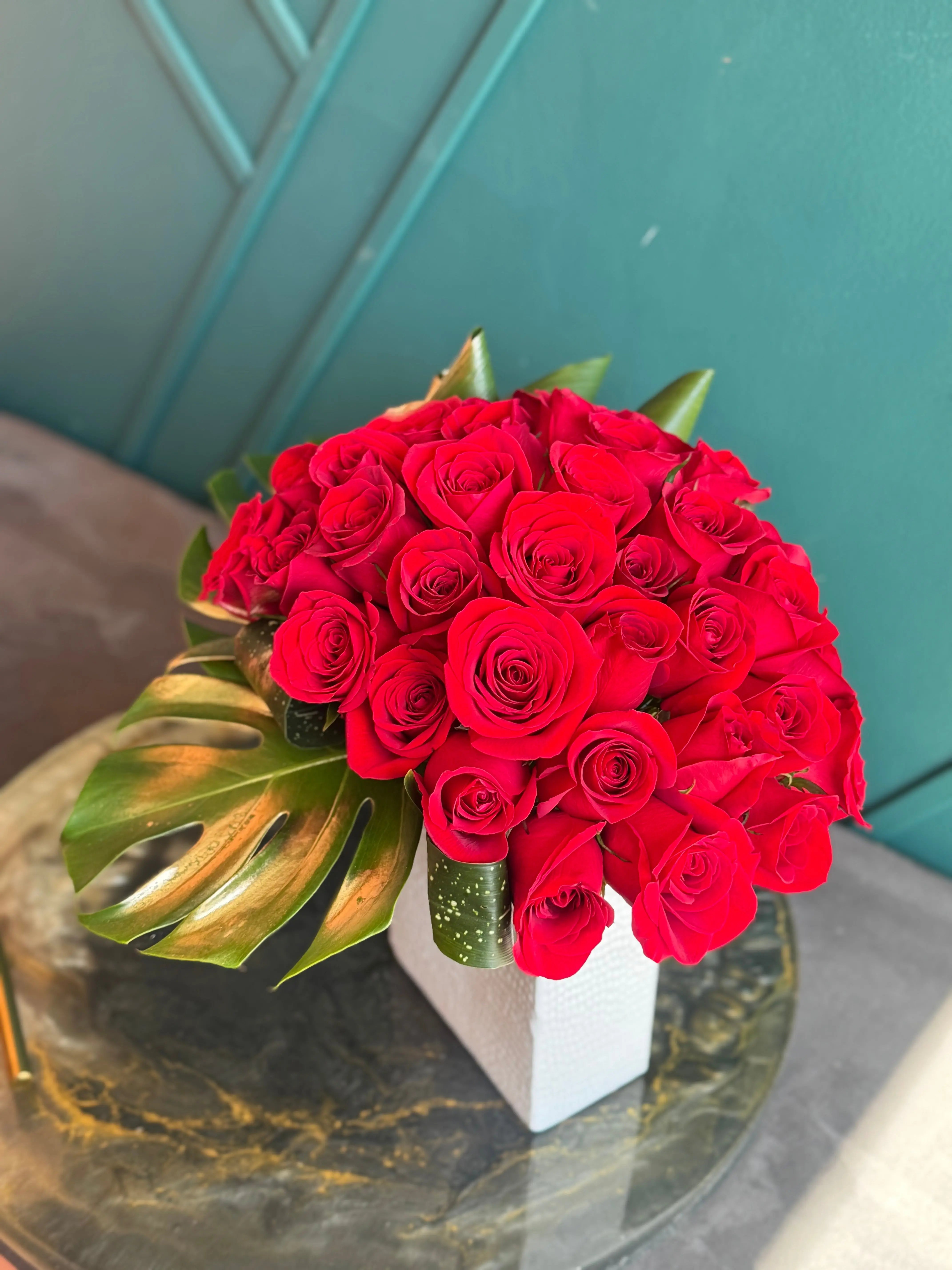 Romantic arrangement of 36 red roses in vase