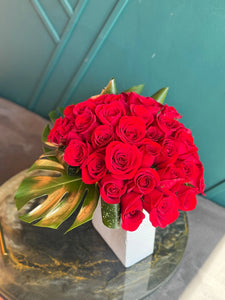Romantic arrangement of 36 red roses in vase