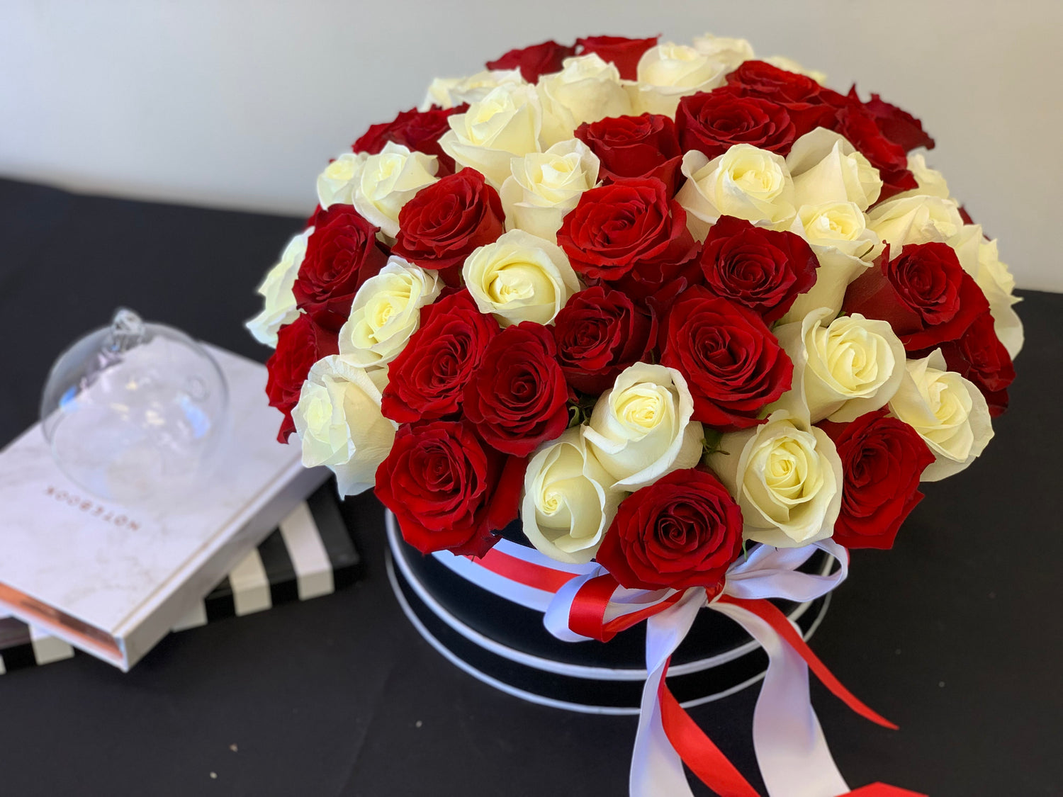 Romantic flower box with red and white roses for anniversaries