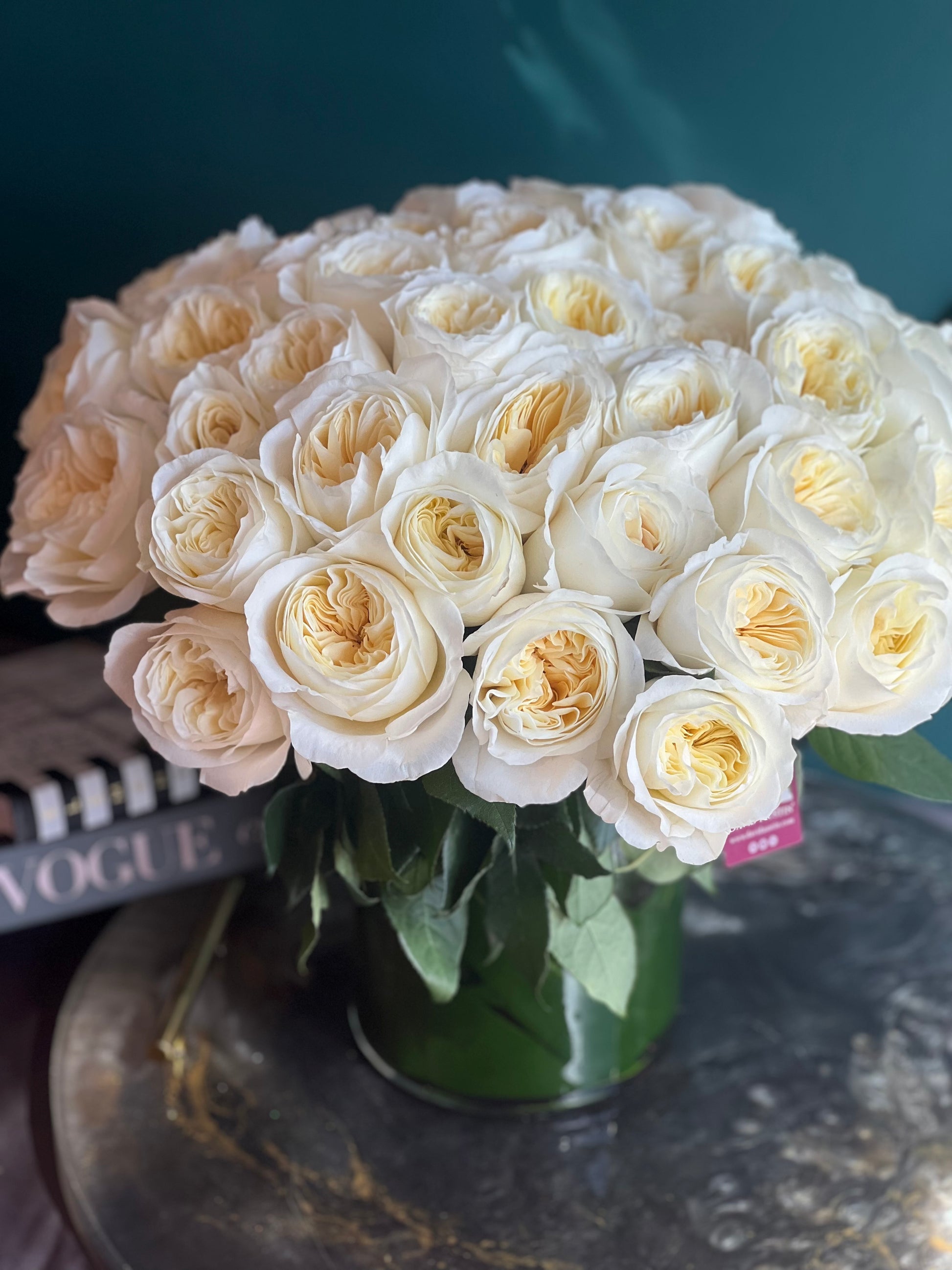 Romantic ivory garden roses arrangement for weddings and anniversaries