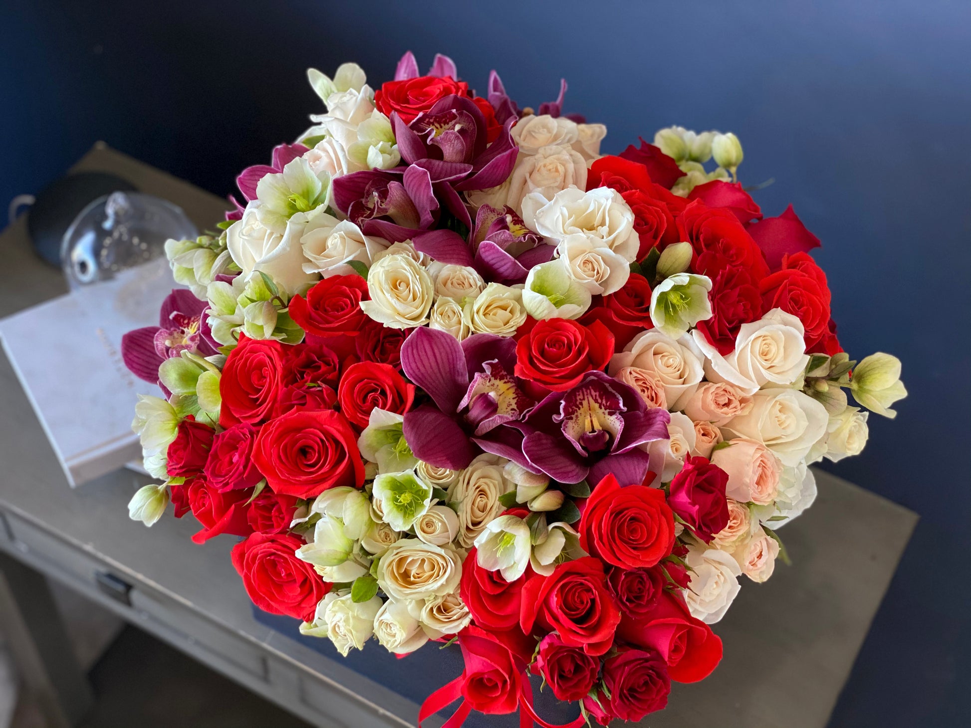Romantic luxury flower arrangement with red spray roses Miami