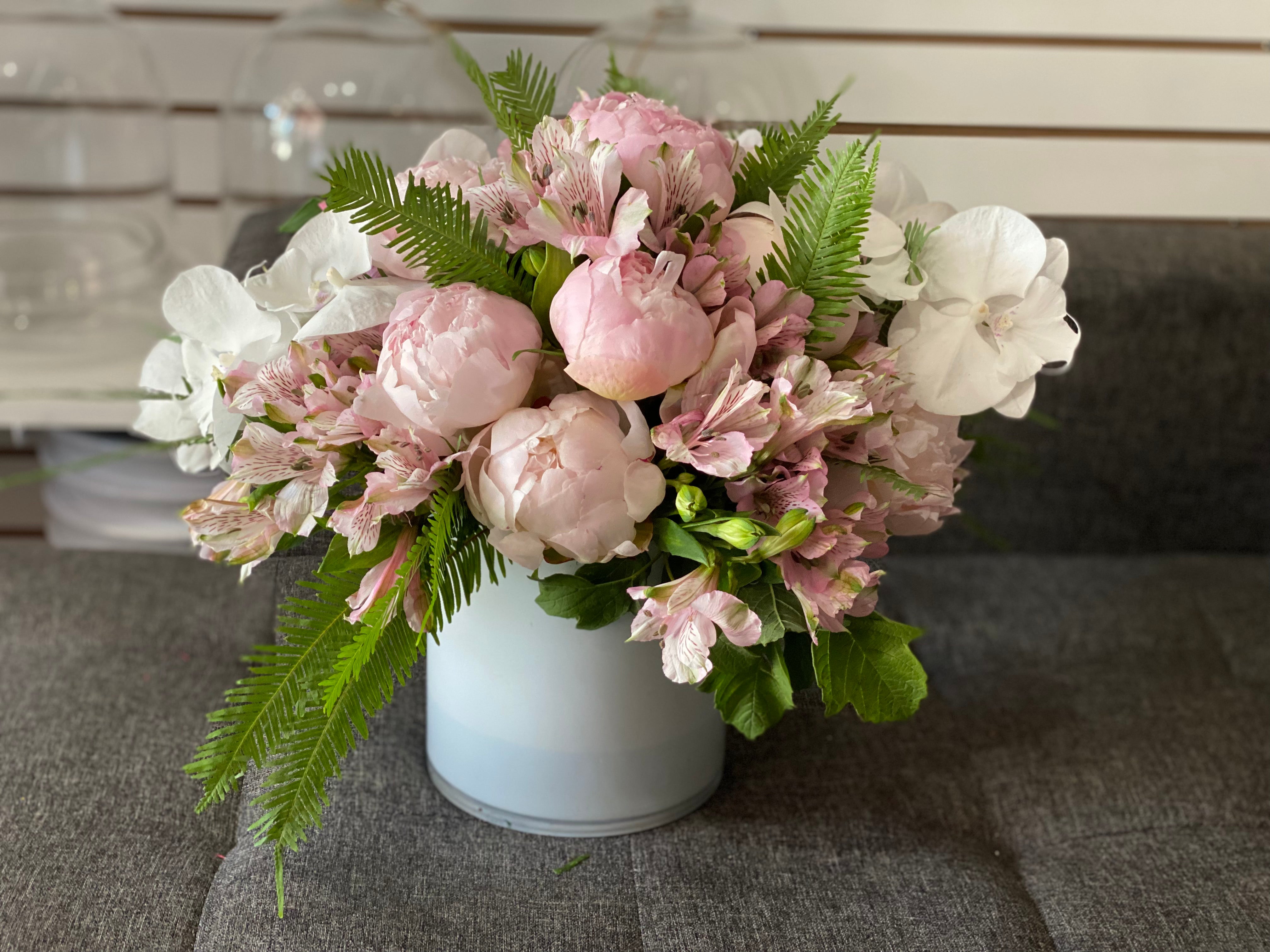 Romantic peony arrangement with soft pink and white flowers