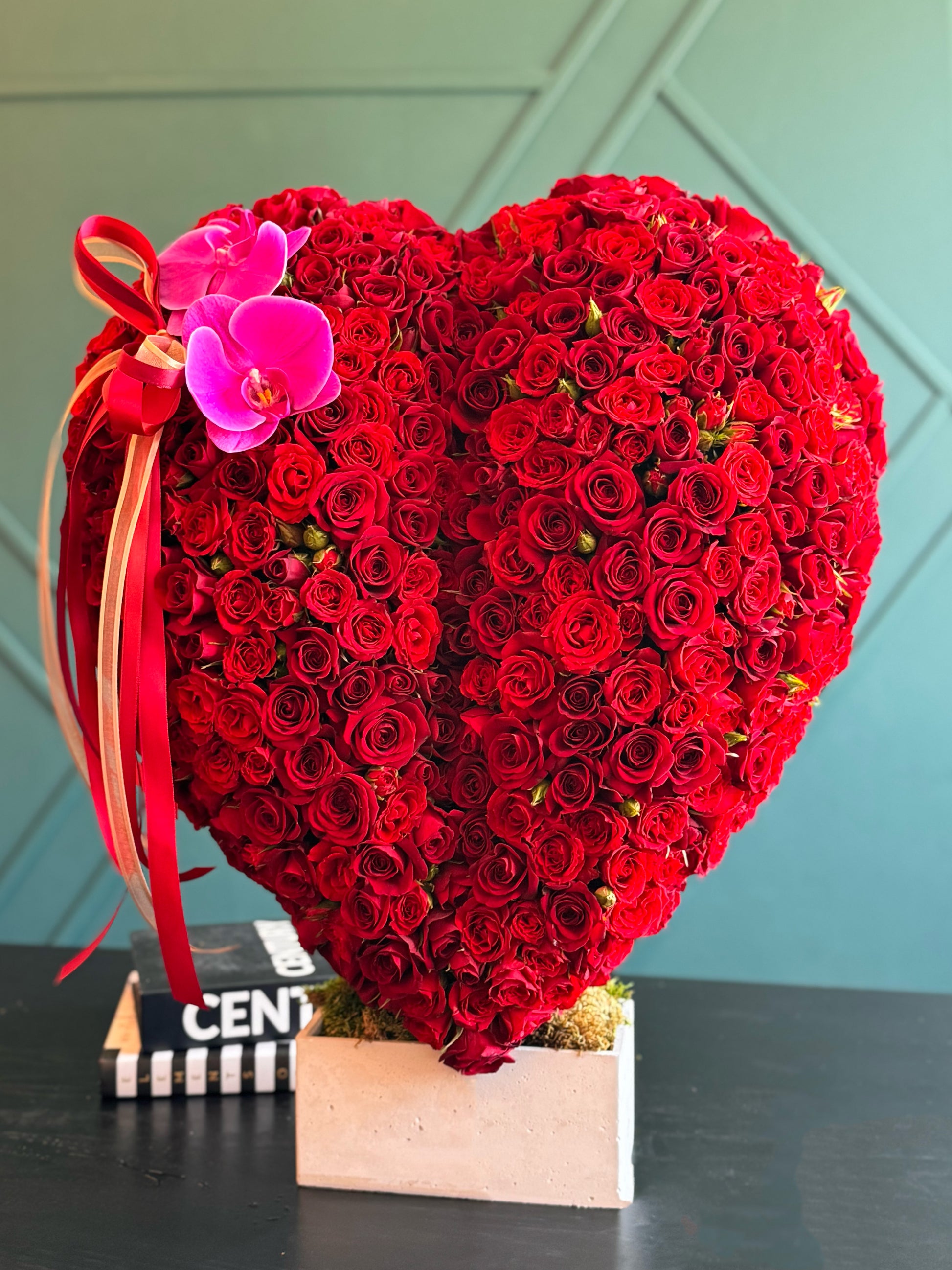 Romantic red rose heart arrangement with Phalaenopsis orchid