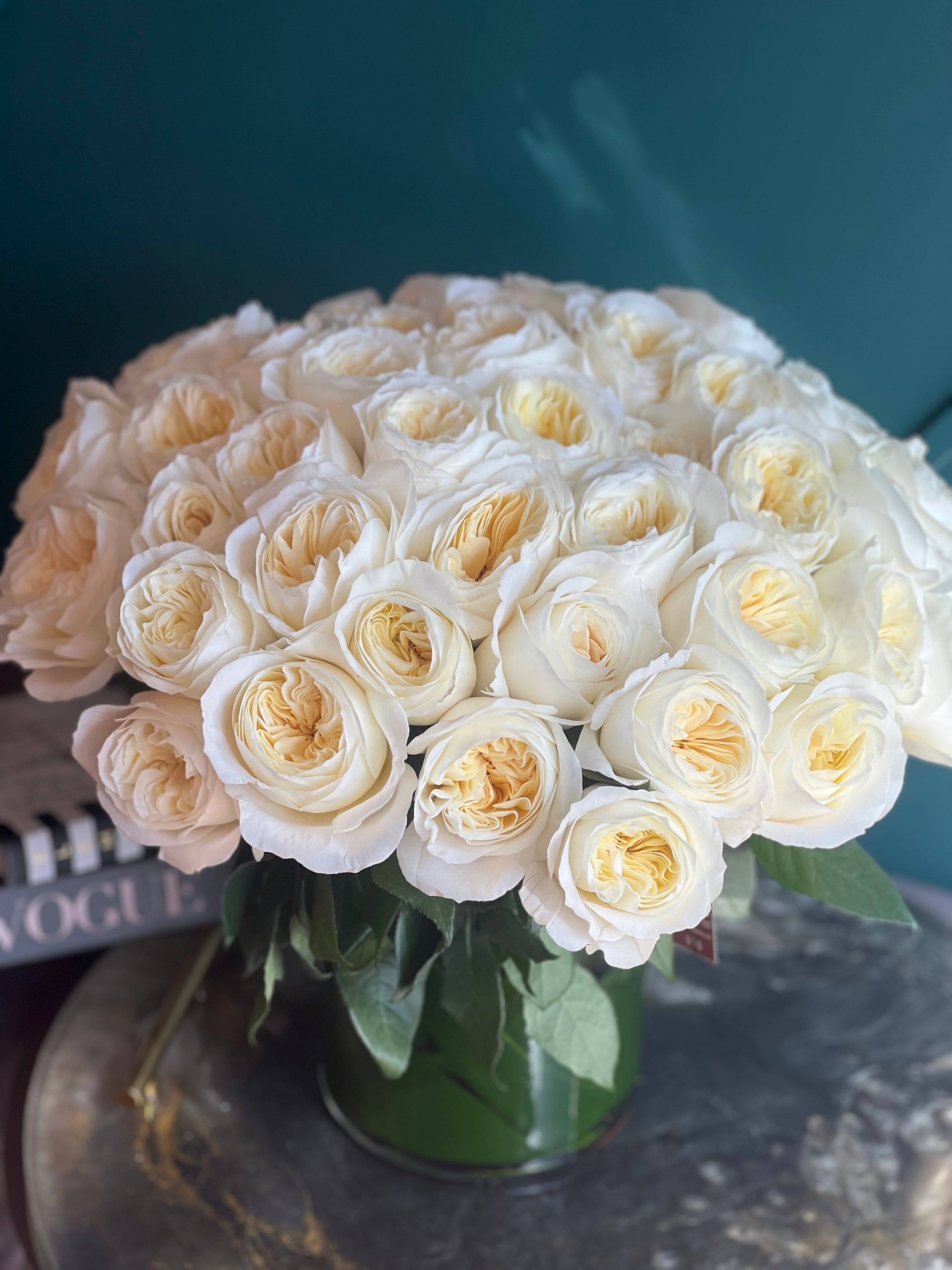 Soft ivory garden rose centerpiece for weddings and special occasions
