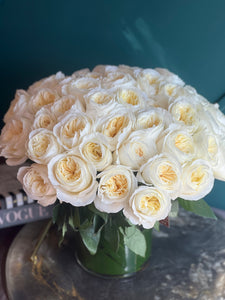 Soft ivory garden rose centerpiece for weddings and special occasions