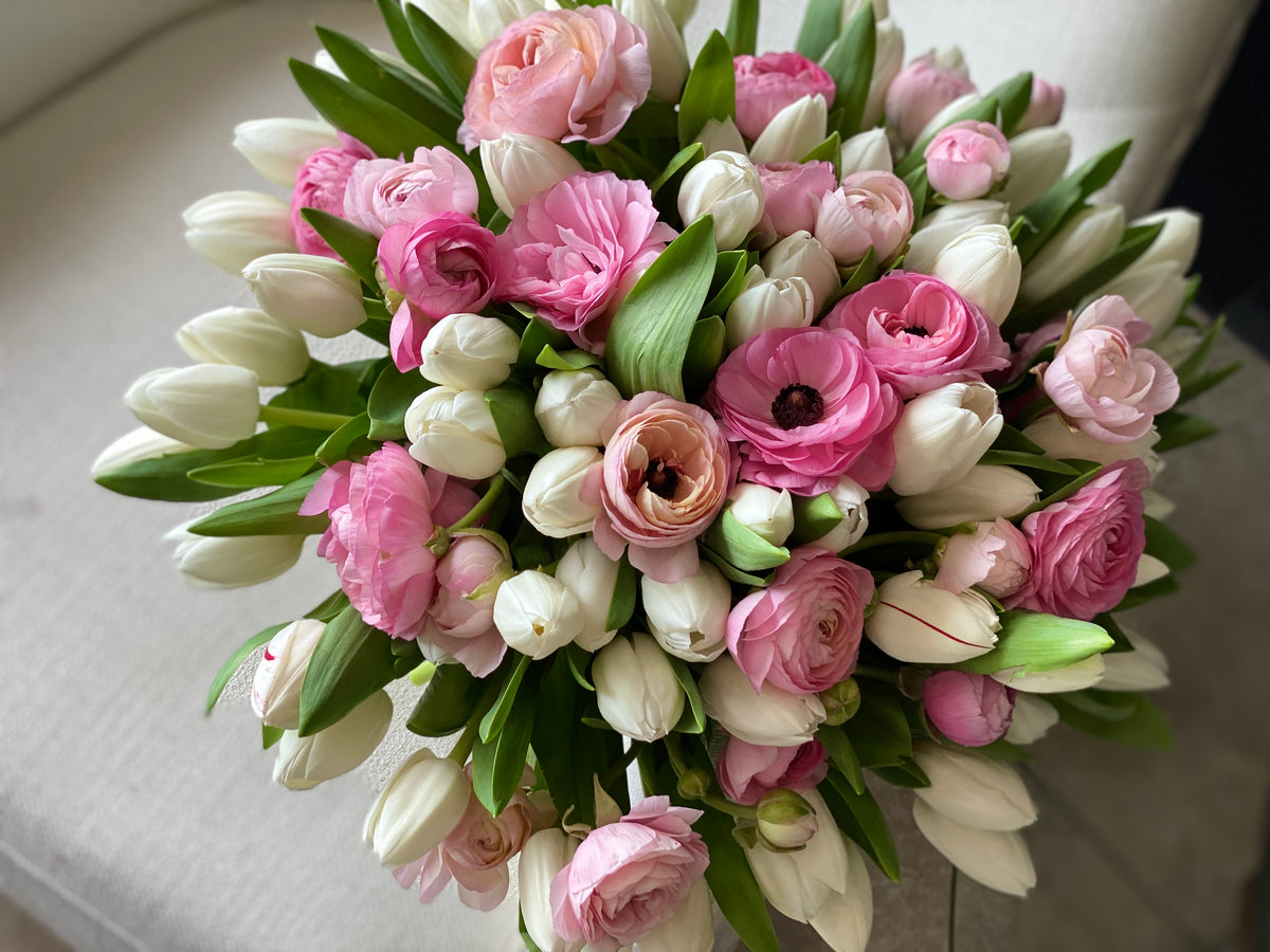 Spring flower arrangement Miami with pink ranunculus and white tulips