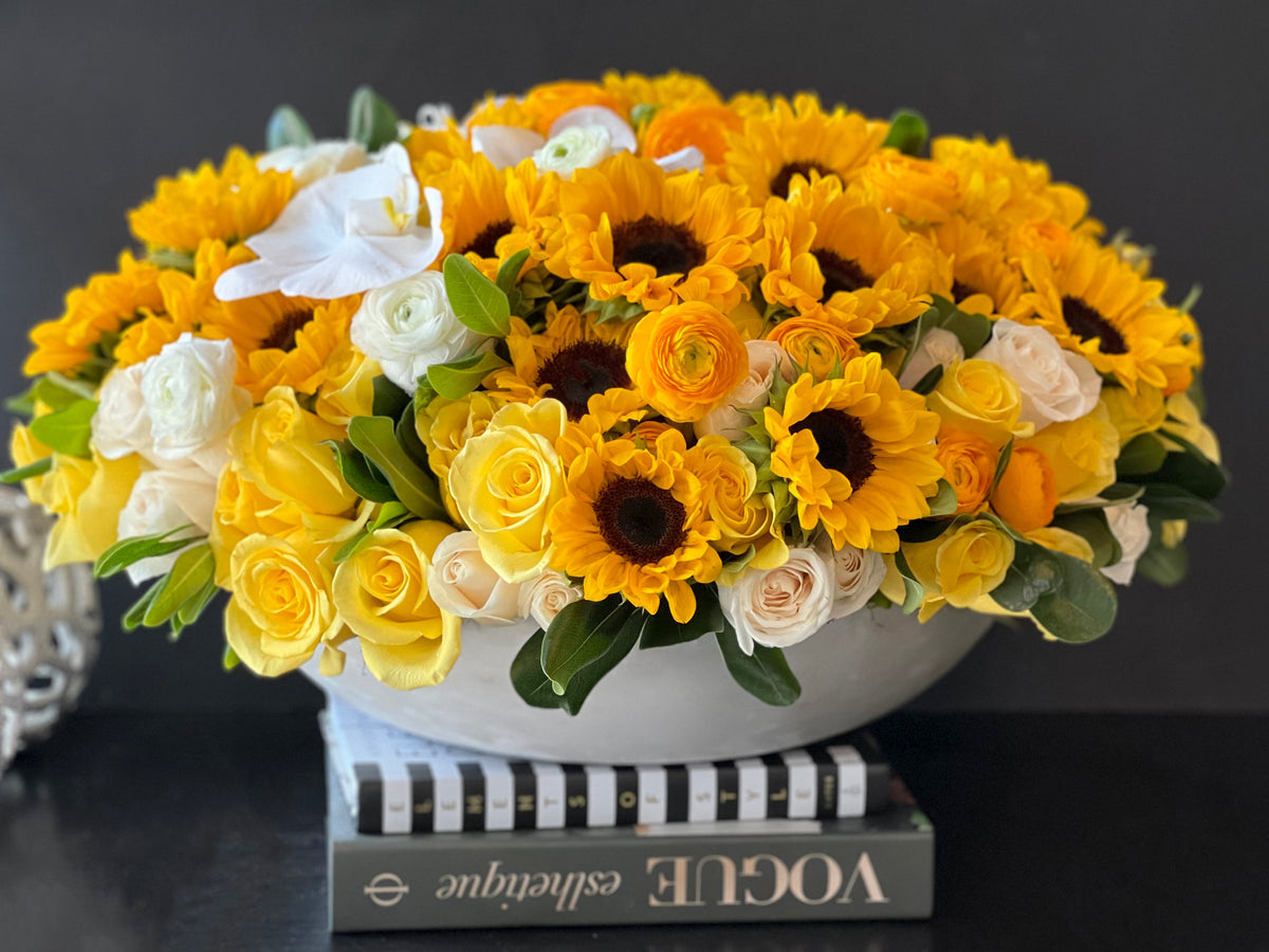 Sunflower rose ranunculus and orchid luxury arrangement Miami