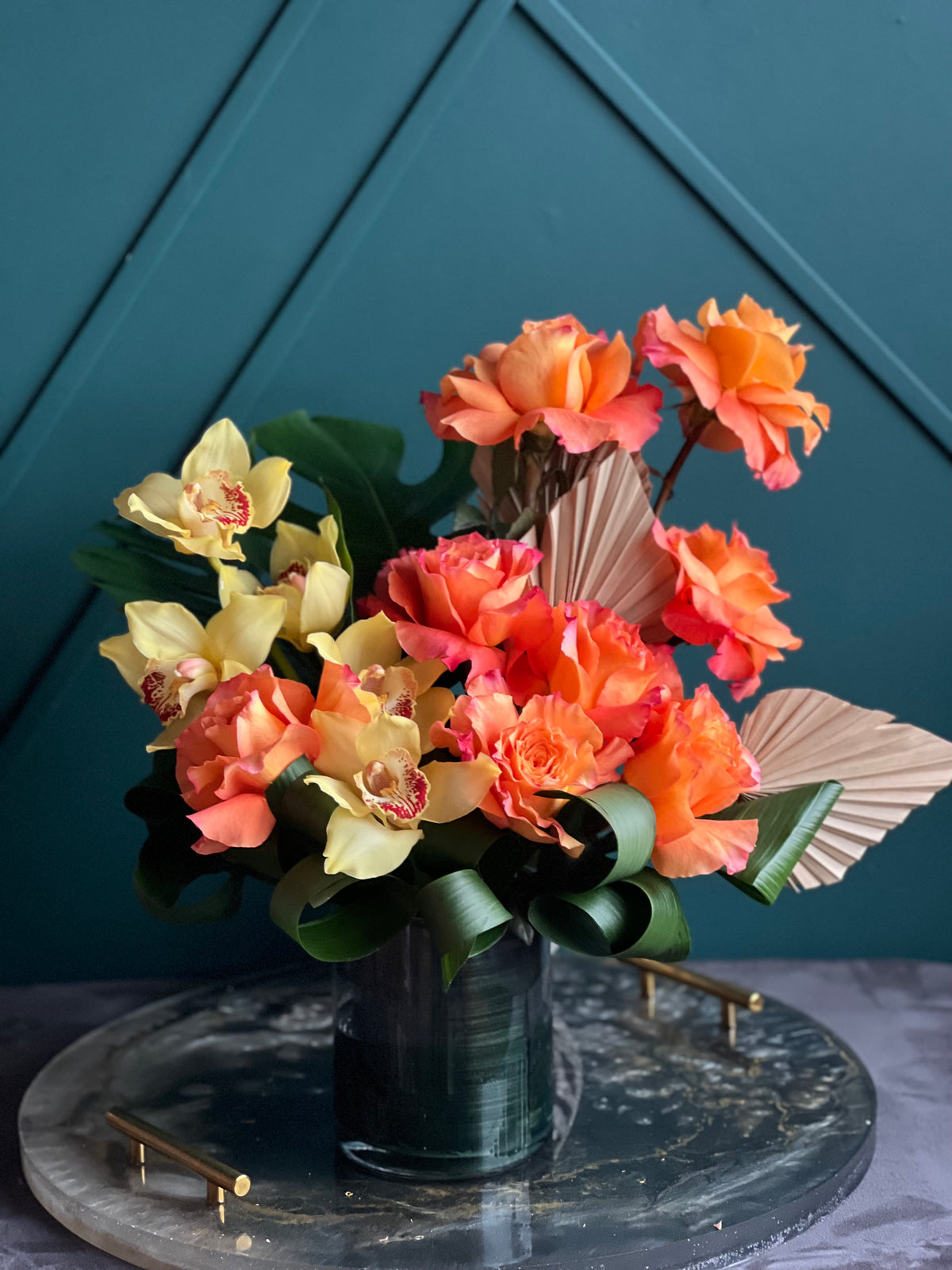Sunset Glow orange rose and yellow orchid flower arrangement