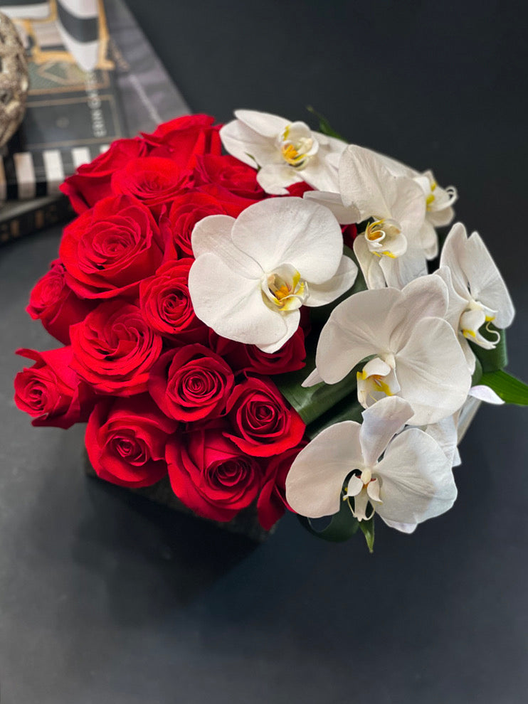 Three dozen red roses with white Phalaenopsis orchids