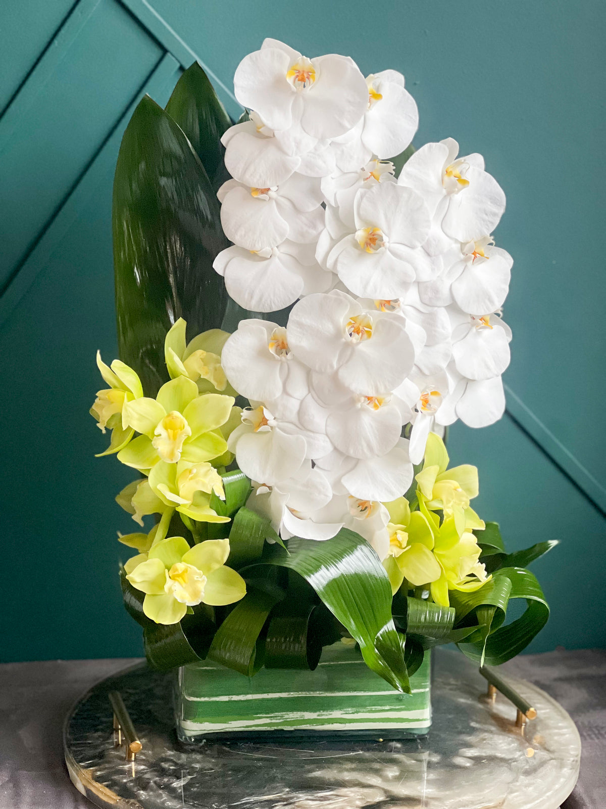 White and green orchid arrangement for Miami flower delivery