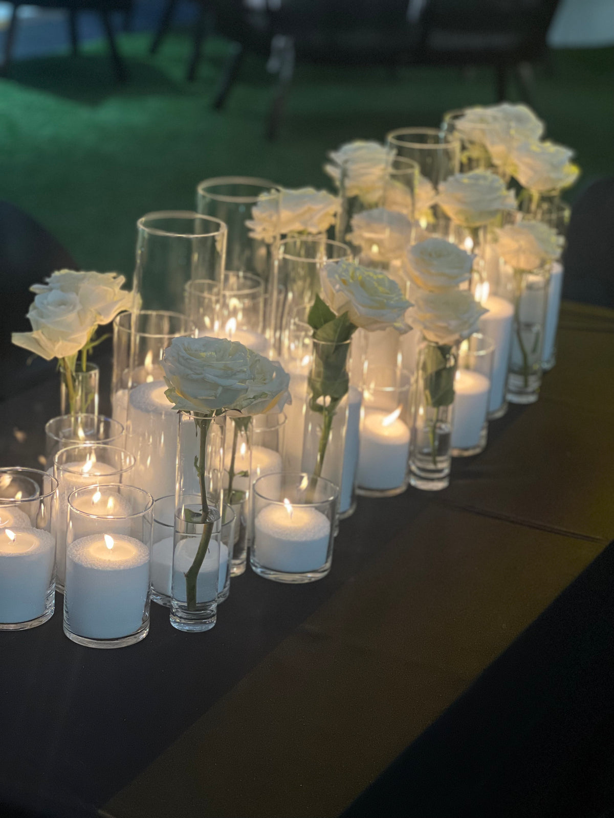 White sand wax candles in clear glass vessels for event styling