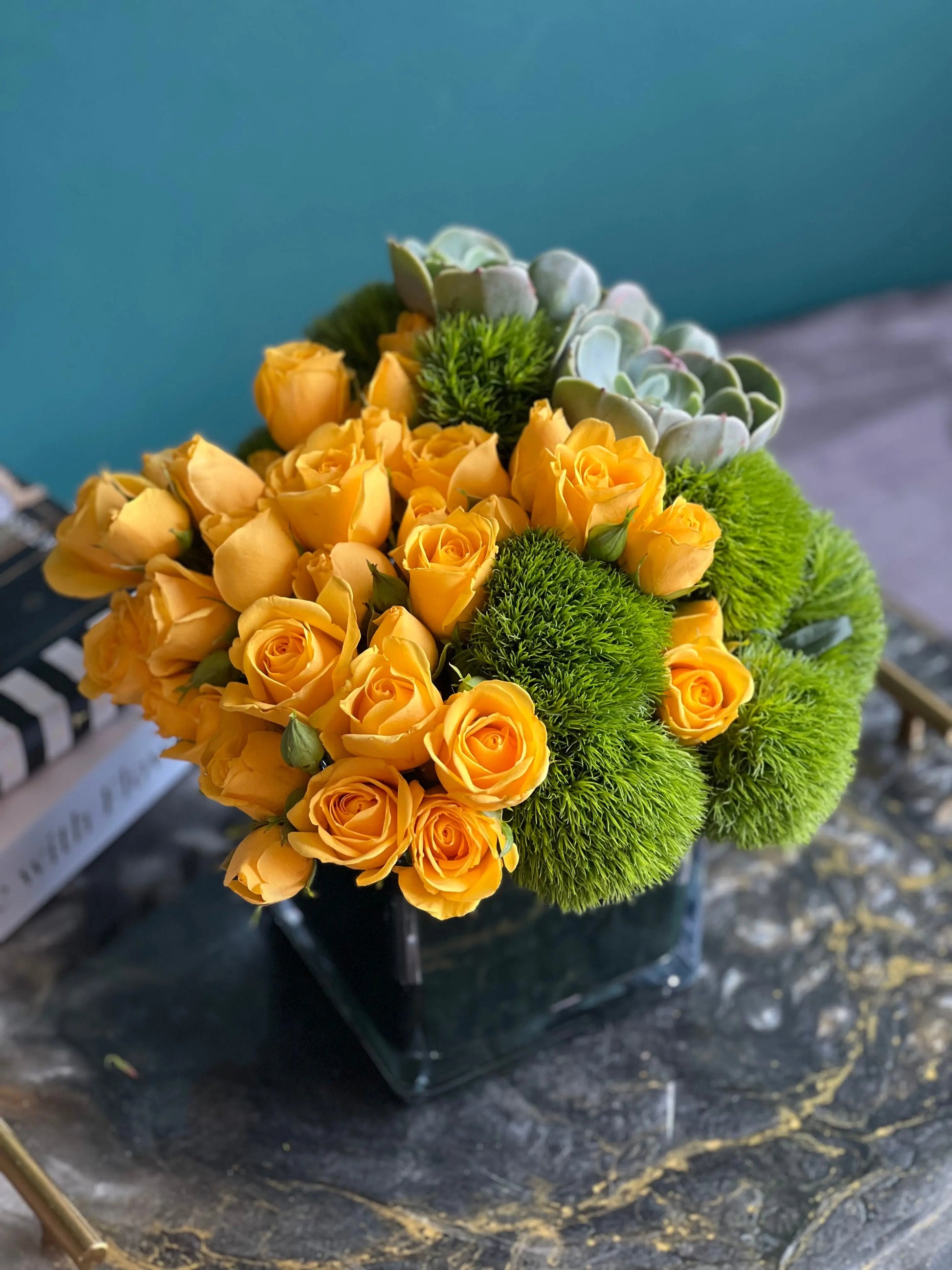 Yellow mini roses with green balls and fresh succulents