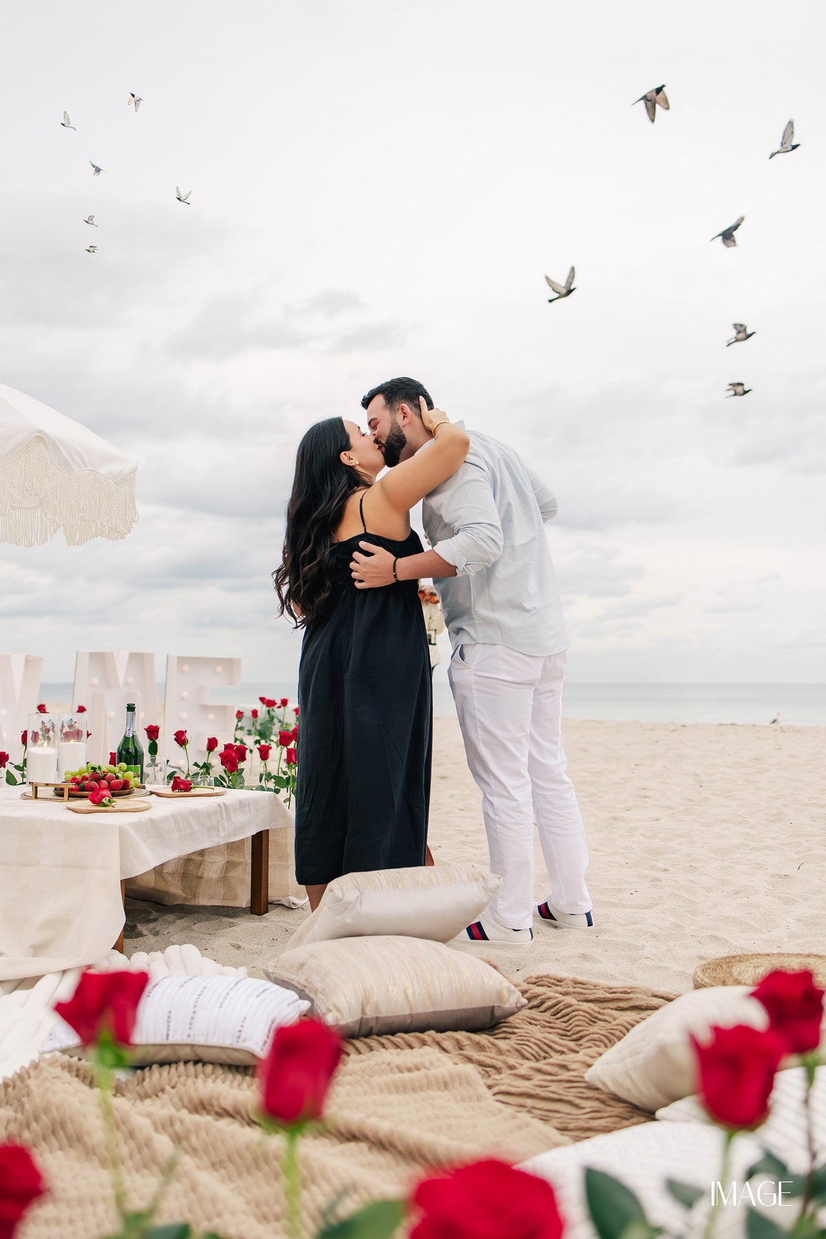 Romantic picnic proposal in Miami with flowers and luxury picnic decor