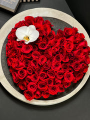 luxury red rose arrangement in handmade cement tray Miami