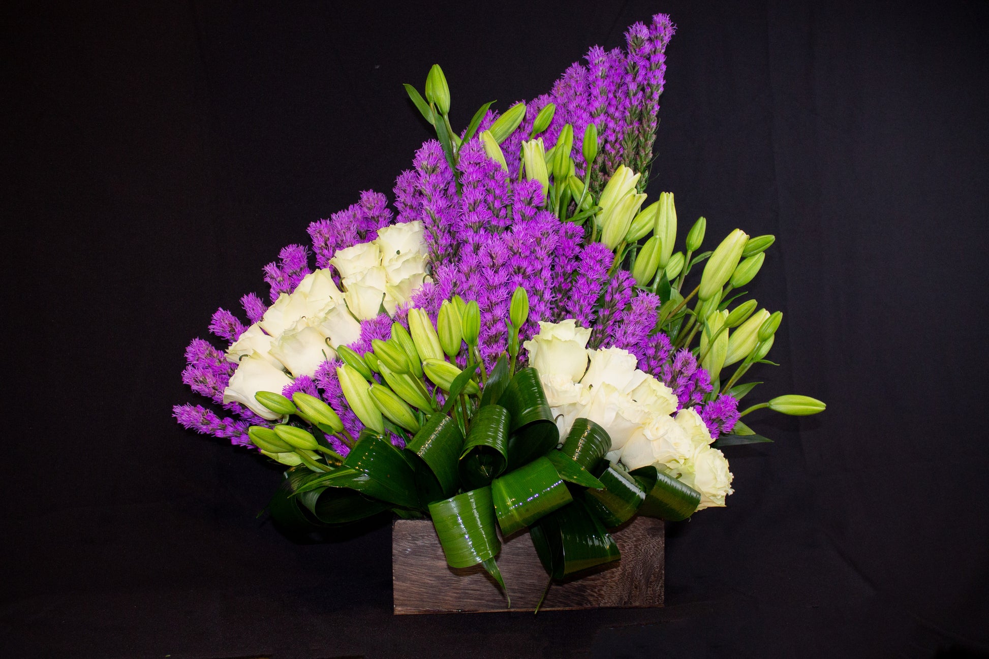 modern liatris flower arrangement with white roses